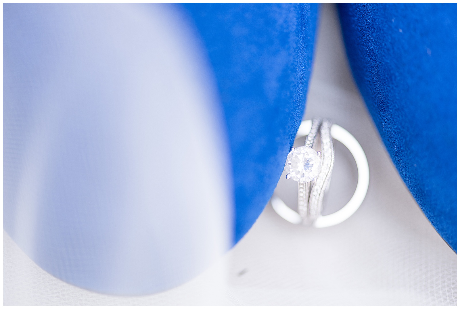 wedding rings beside blue wedding shoes