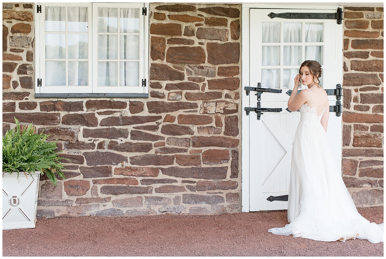 bridal portraits in front of stone building