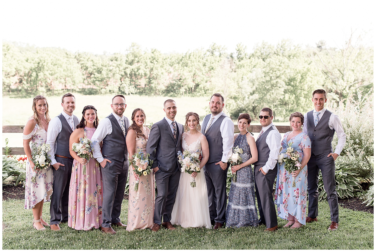 bridal party - bridesmaids in floral dresses and groomsmen's ties matching
