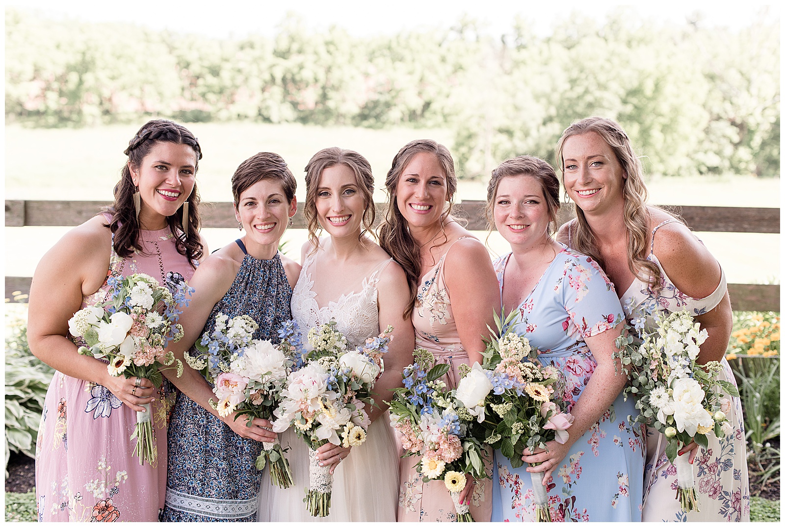 bridesmaids in different floral dresses