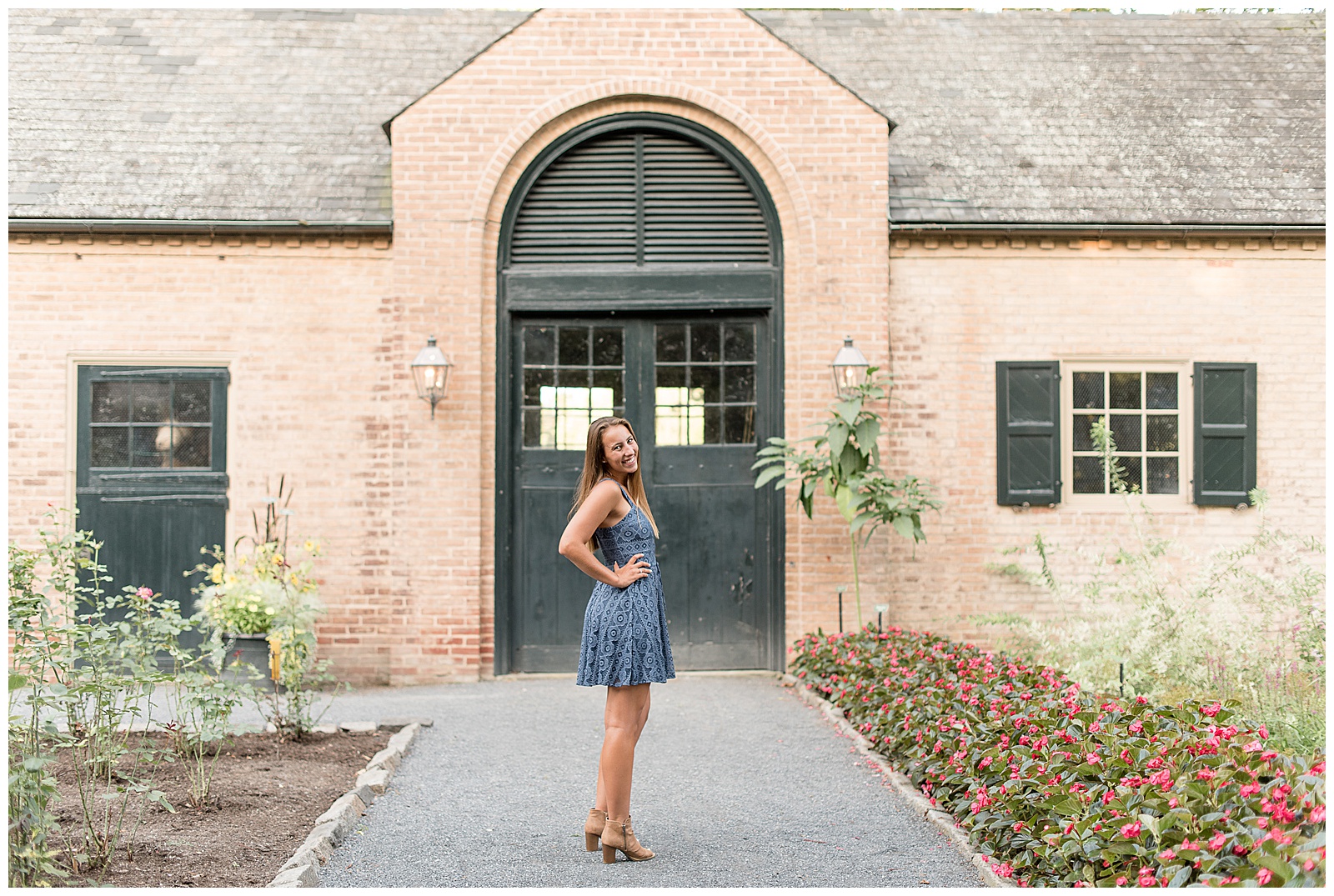 senior girl in front of large green arch door