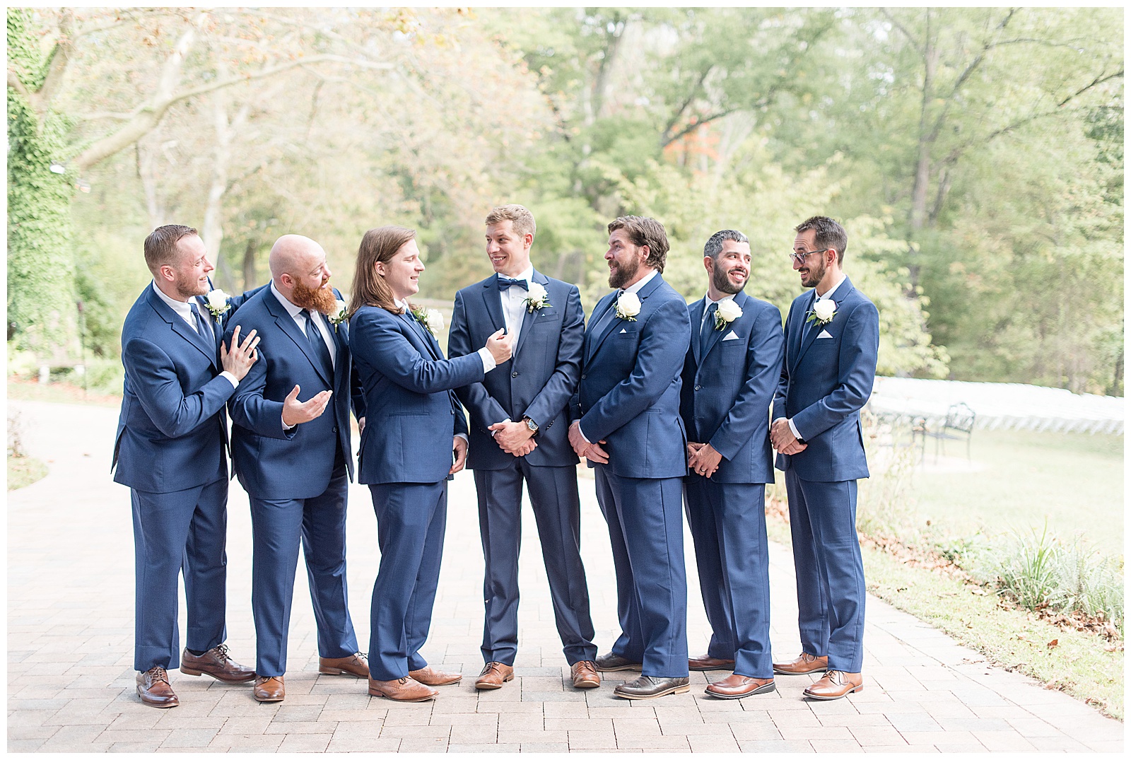 groomsmen laughing and talking with each other