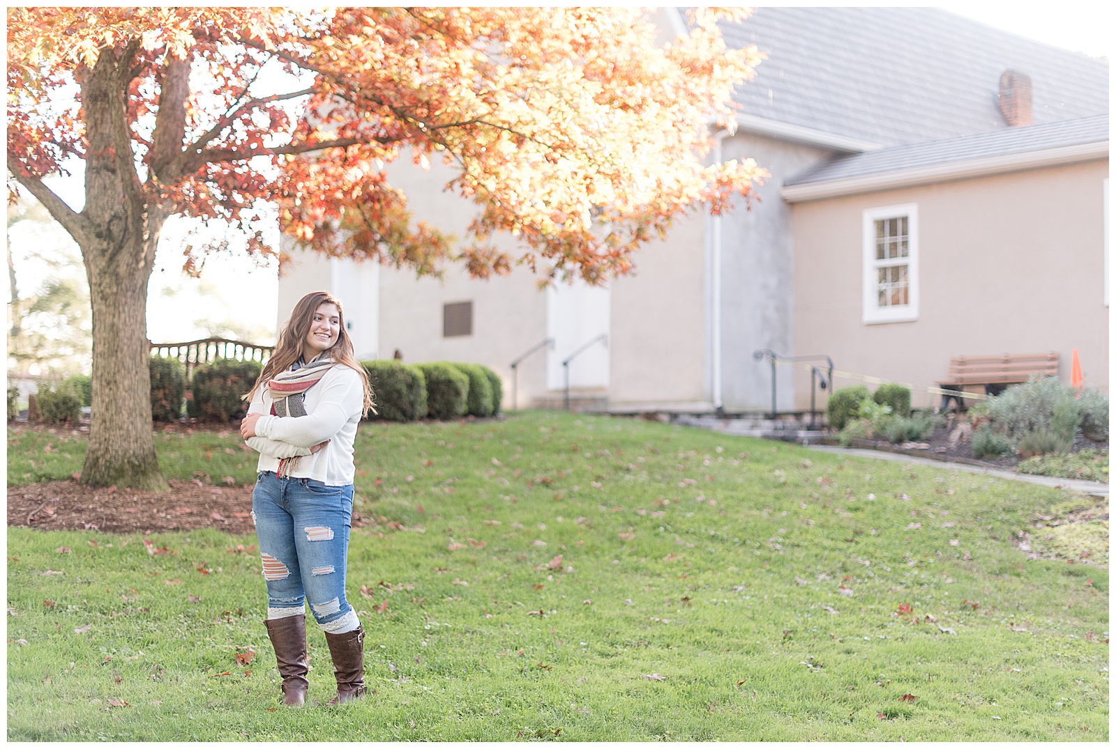 girl senior session in front of fall tree