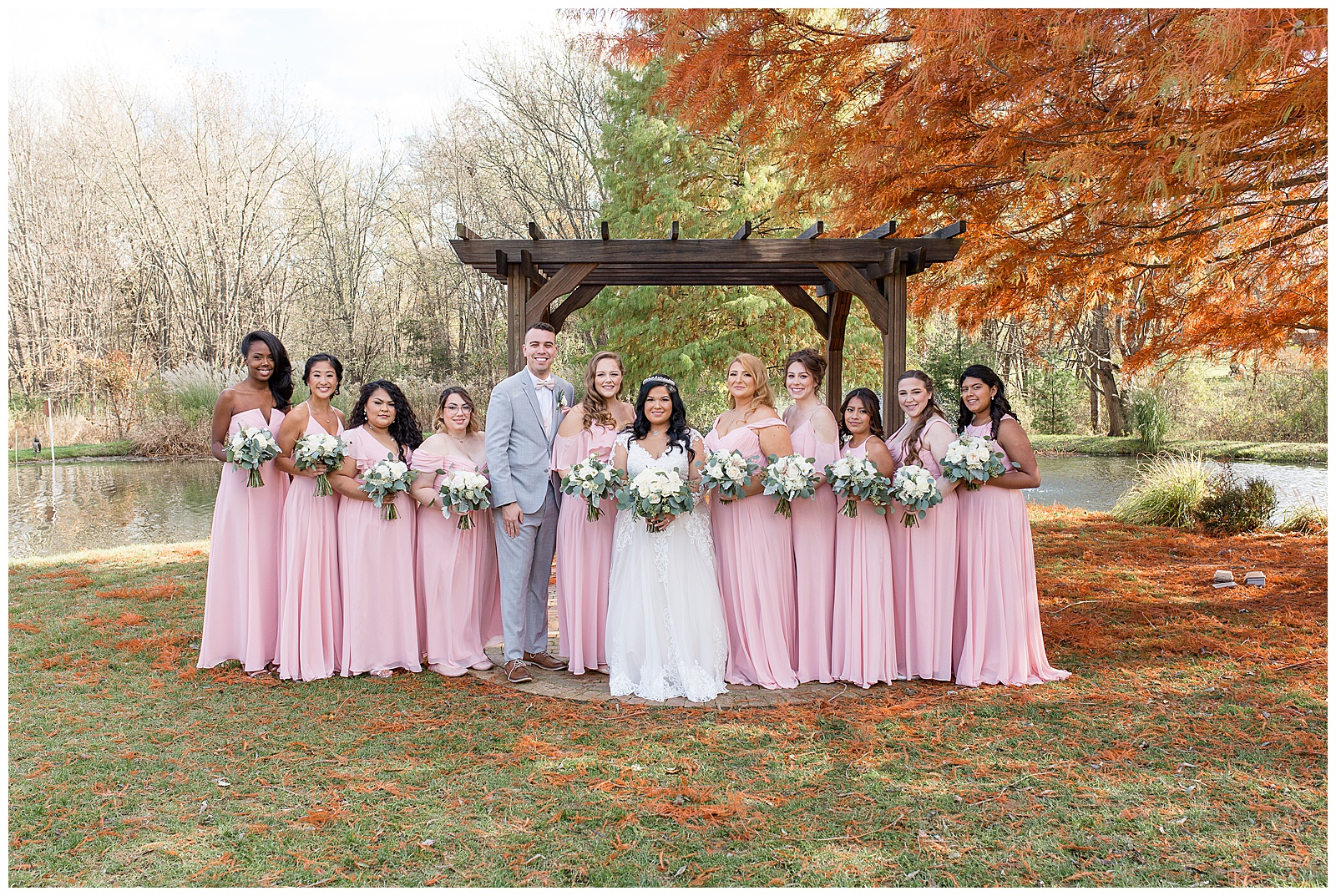 bridesmaids in light pink dresses with while floral bouquets