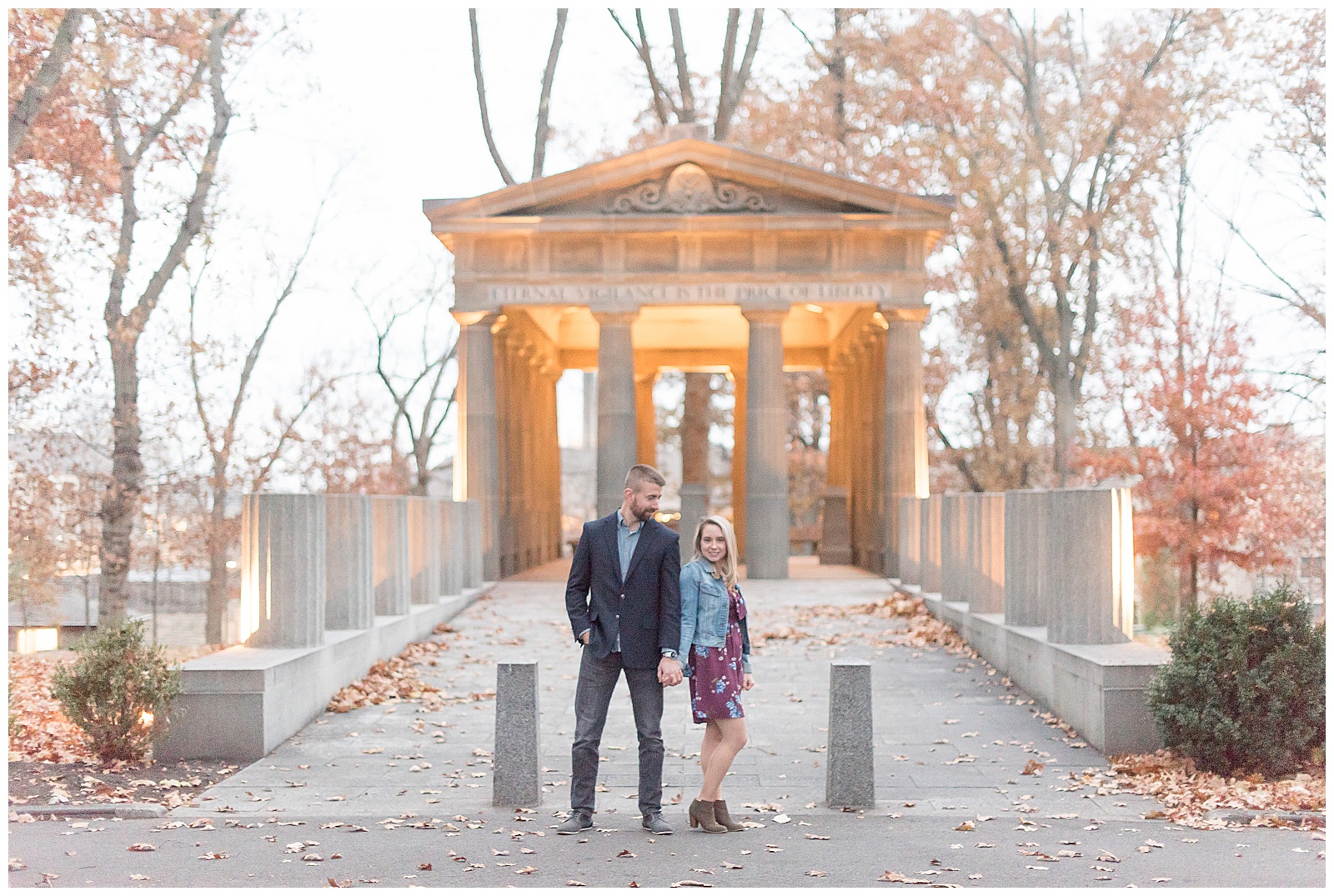 couple standing in front of architectural monument at Masonic Village
