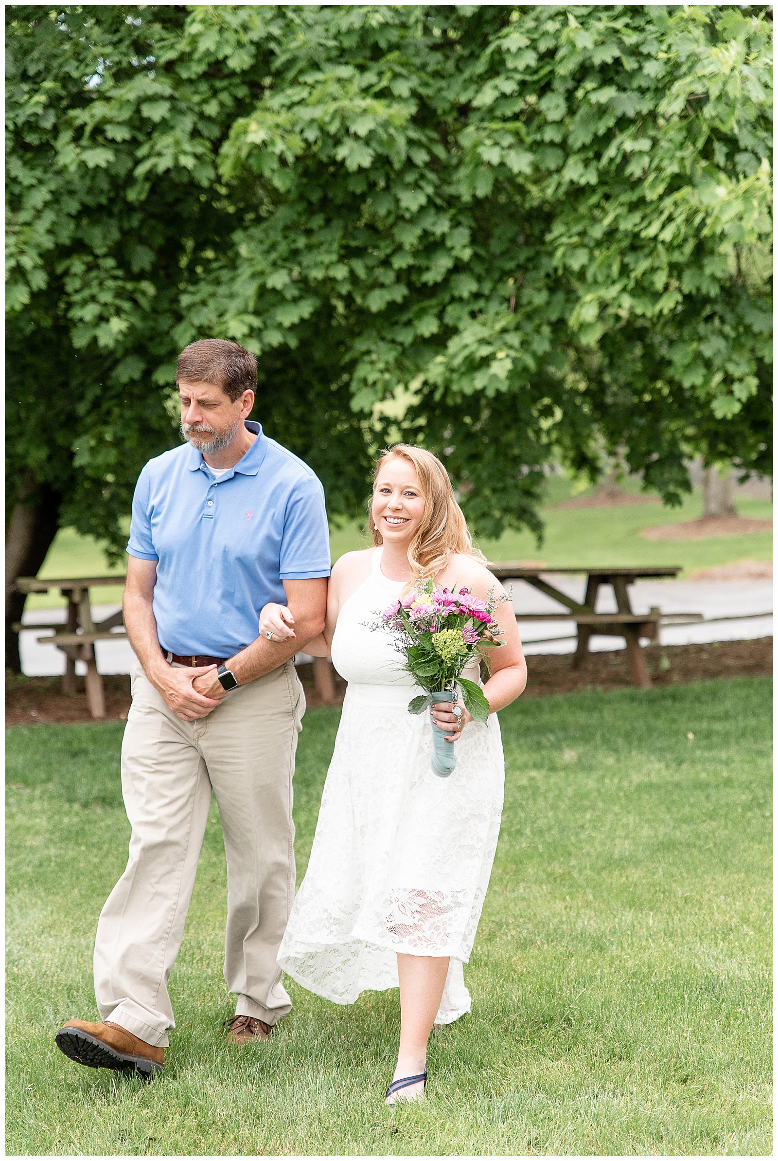 bride walked down isle with dad to ceremony