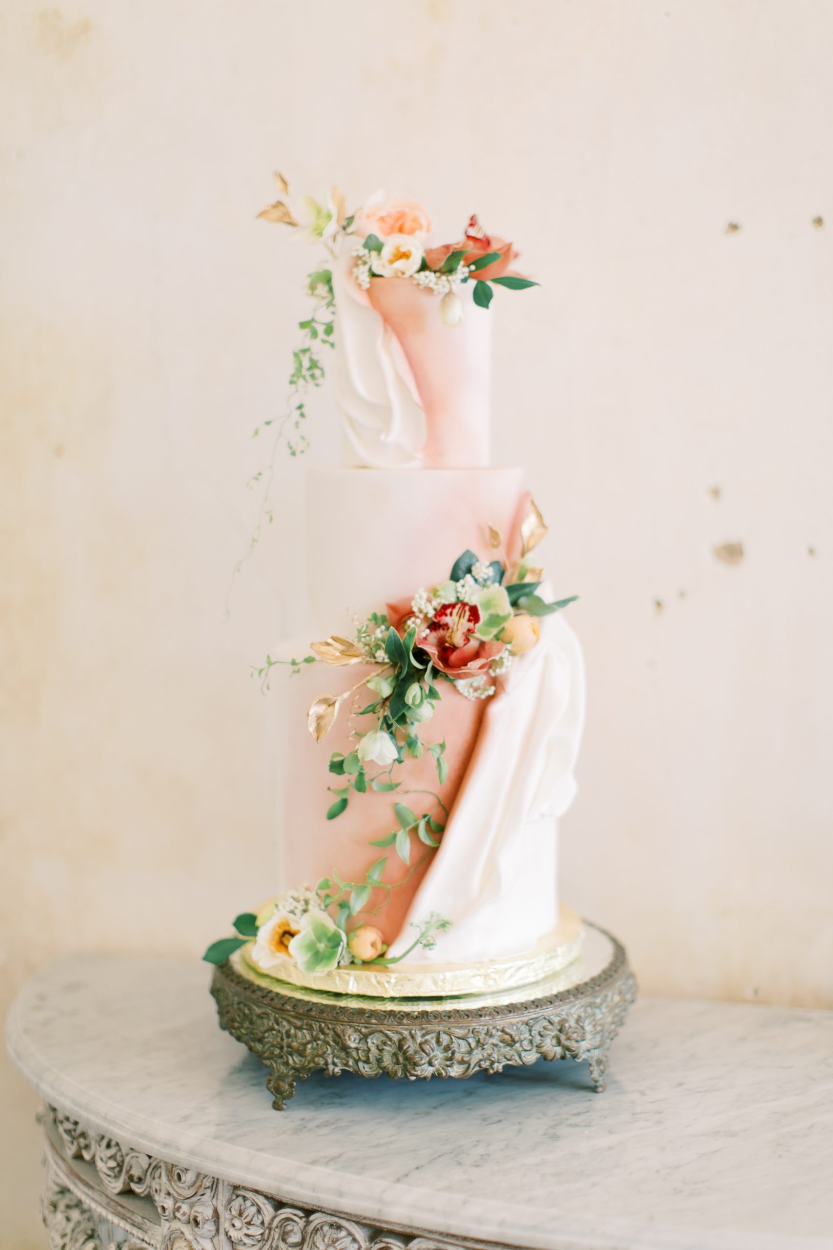 full length cake photo with pastel colors and florals on it