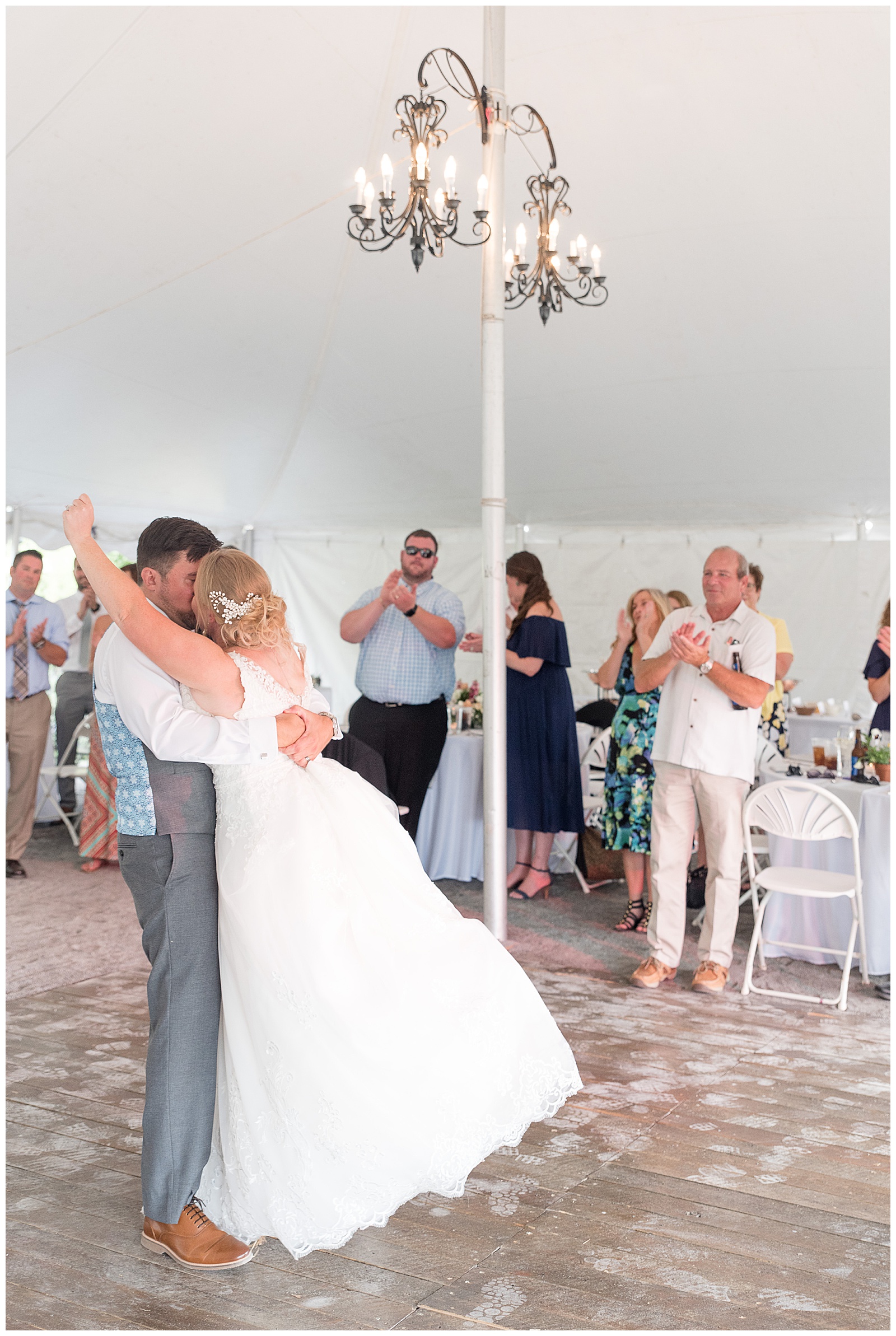 husband and wife first dance in white tent at Fallen Tree Farms