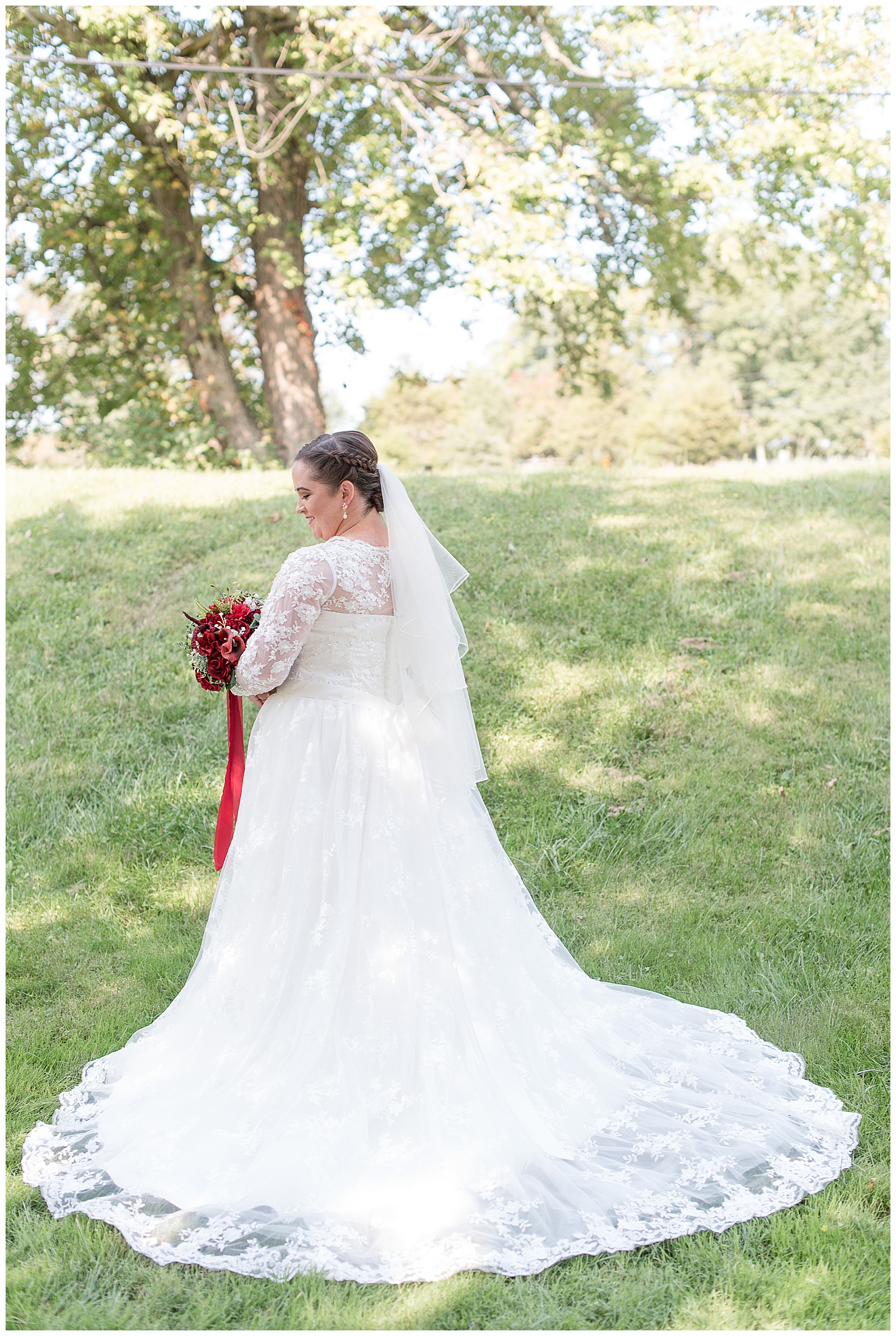 bride outdoors with maroon bouquet on sunny fall day in morgantown pennsylvania