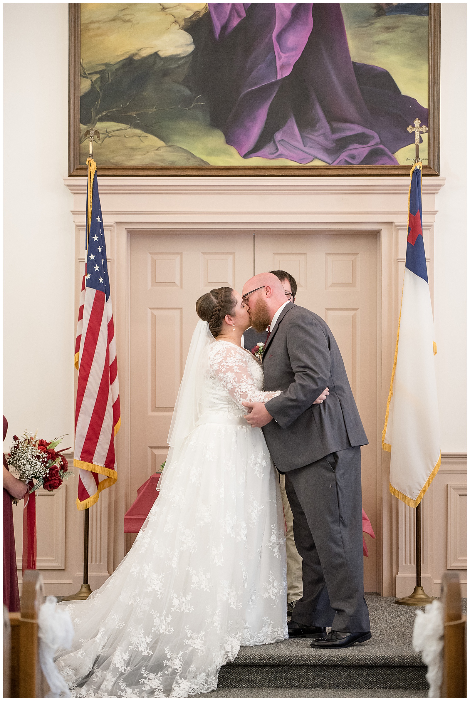 bride and groom kiss during intimate fall church wedding in morgantown pennsylvania