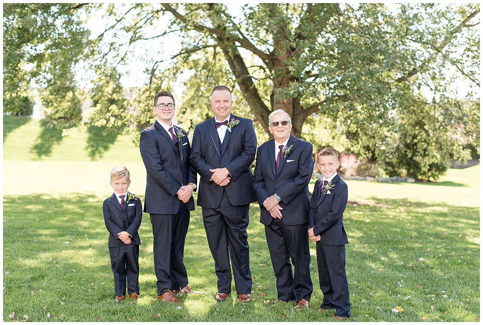 Groomsmen portraits of guys smiling at camera, nephews and dad as groomsmen
