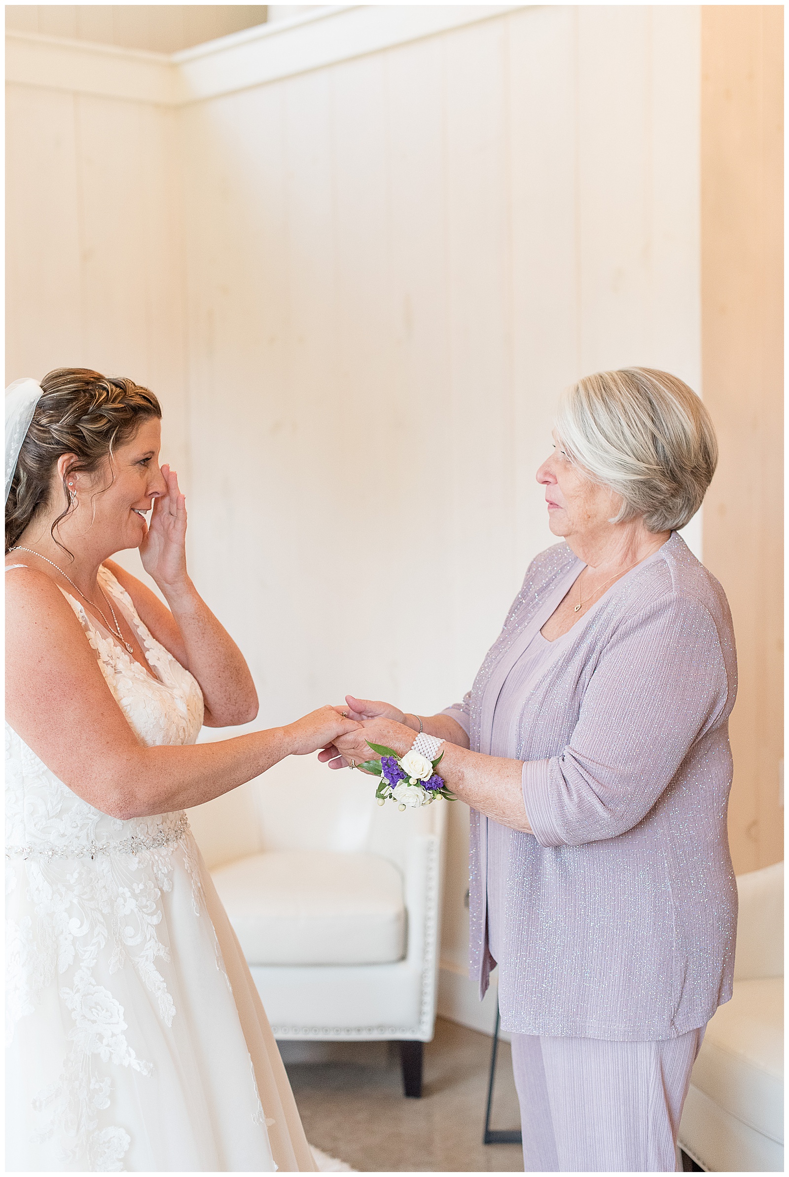 groom's mom giving family ring to bride to wear as a something borrowed