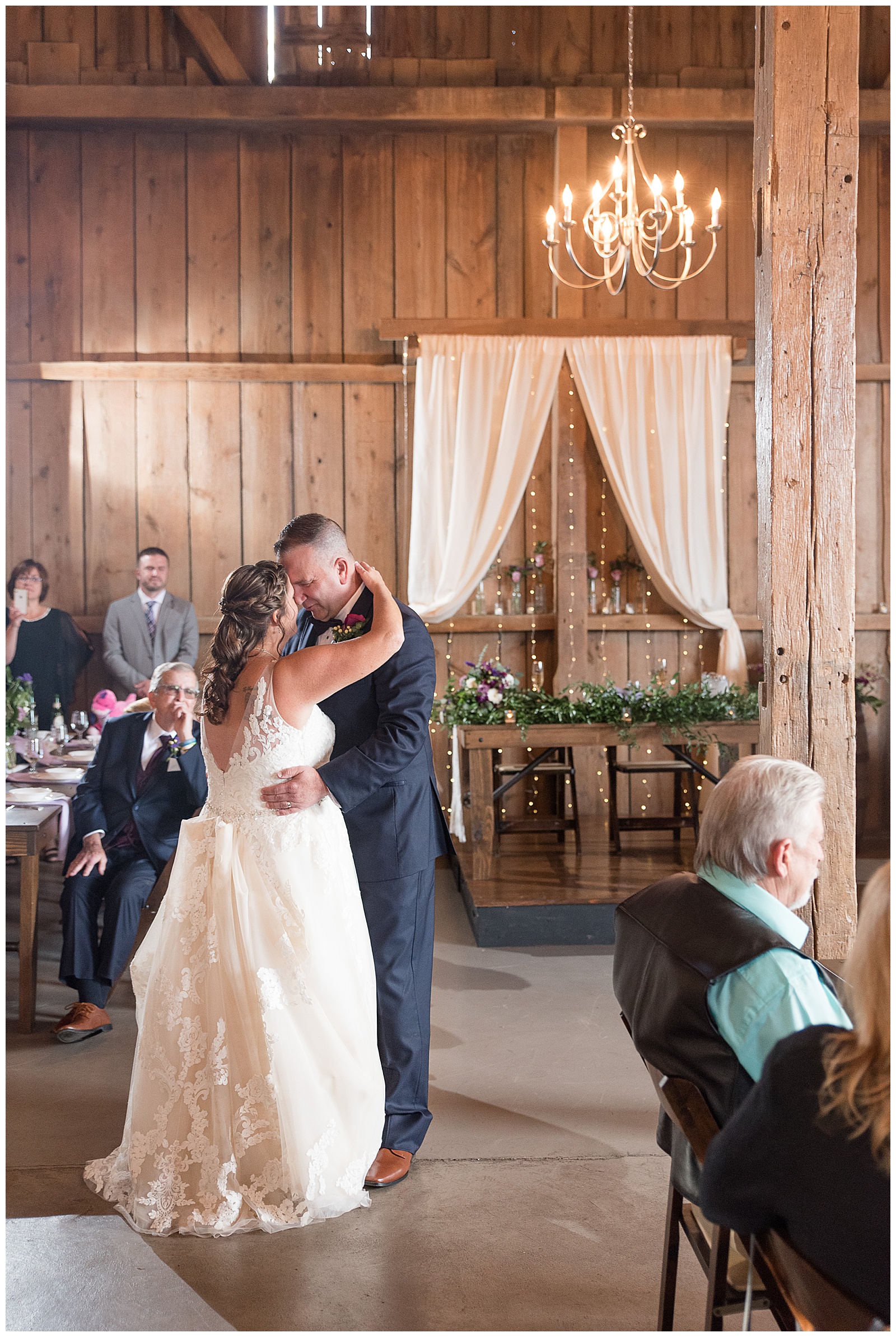 bride and groom sharing first dance in rustic wood barn venue in Lancaster, PA