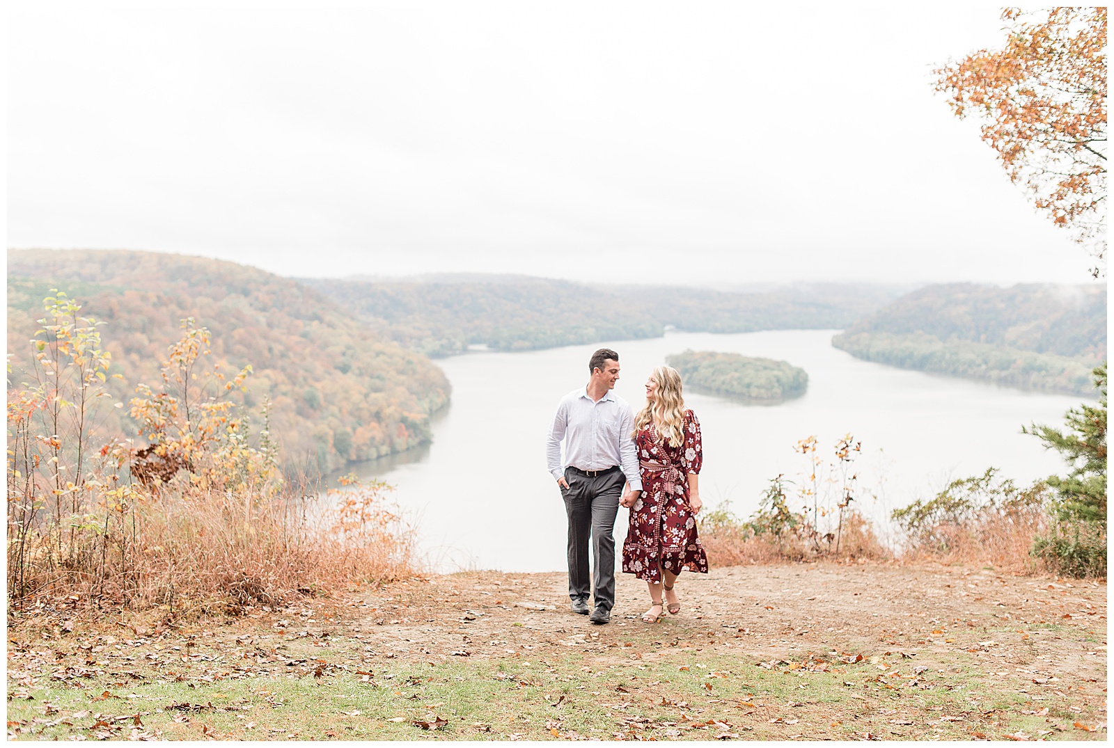 couple walking atop fall lookout at pinnacle point in central pennsylvania