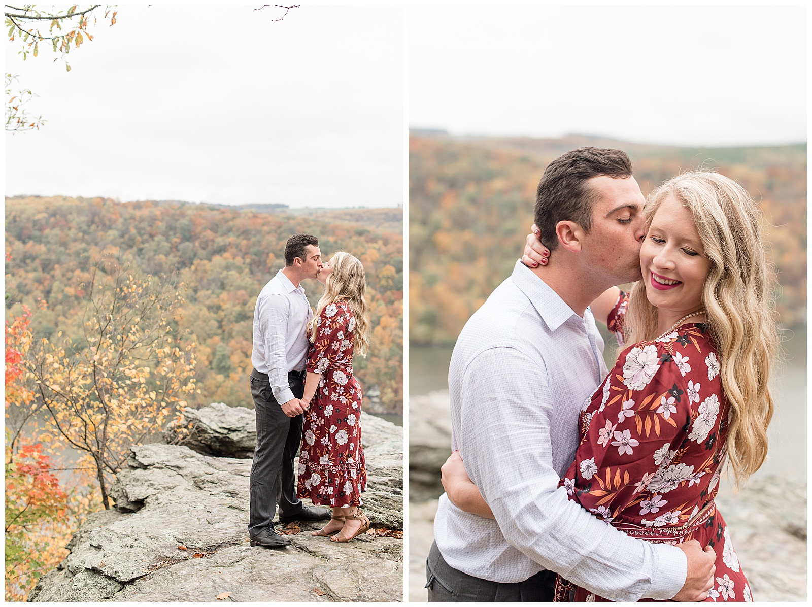 couple kissing atop rock lookout with colorful trees behind them on cloudy day