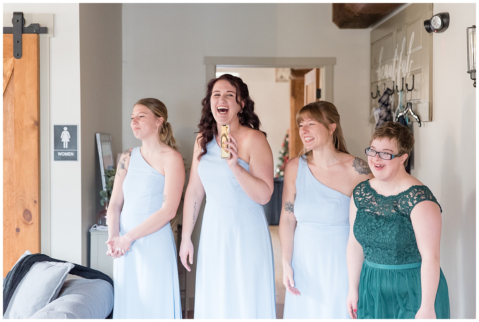 bridesmaids wearing light blue and teal dresses smiling and laughing in lancaster pennsylvania