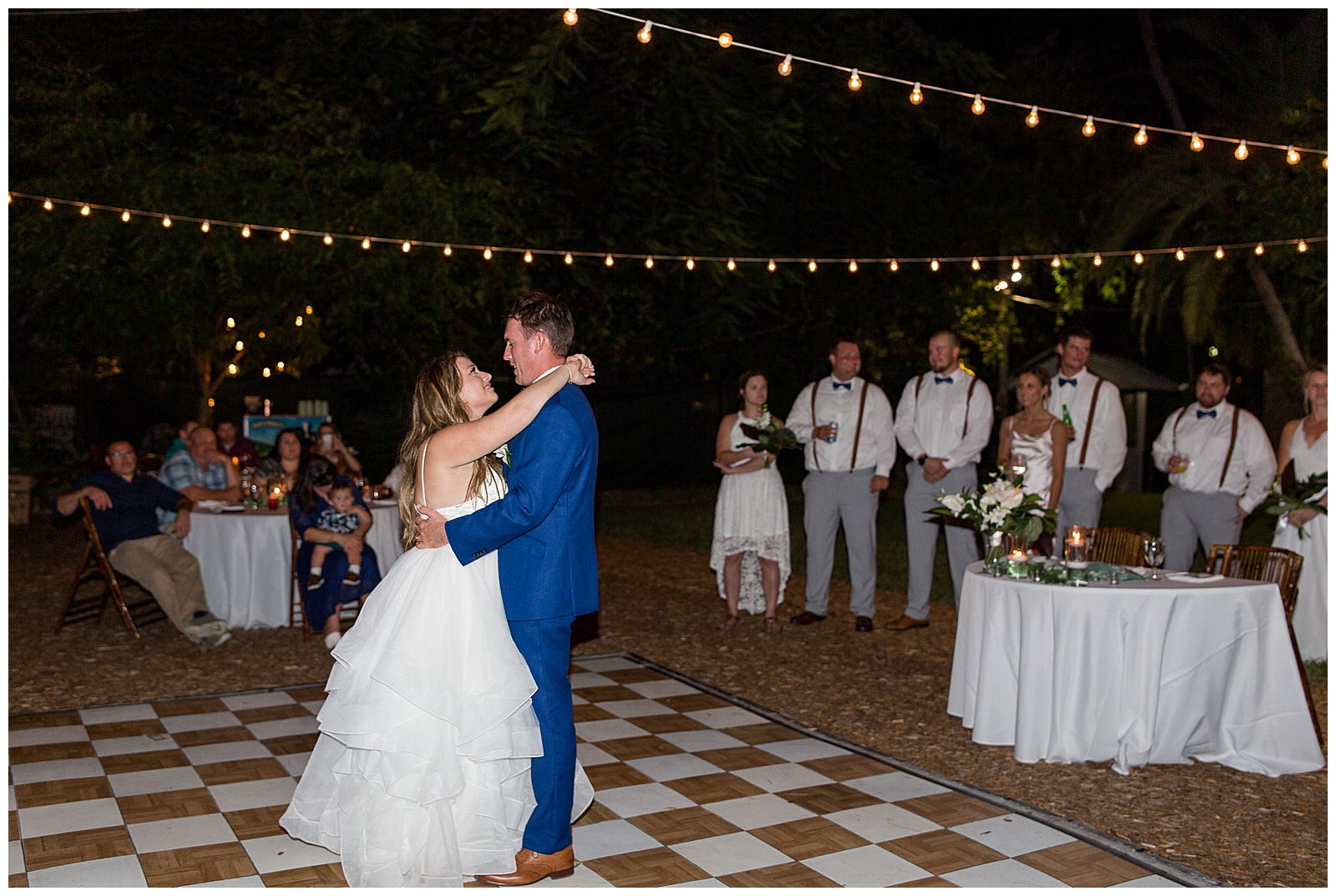 couple slow dancing the night away on their wedding day with guests watching at hemingway house