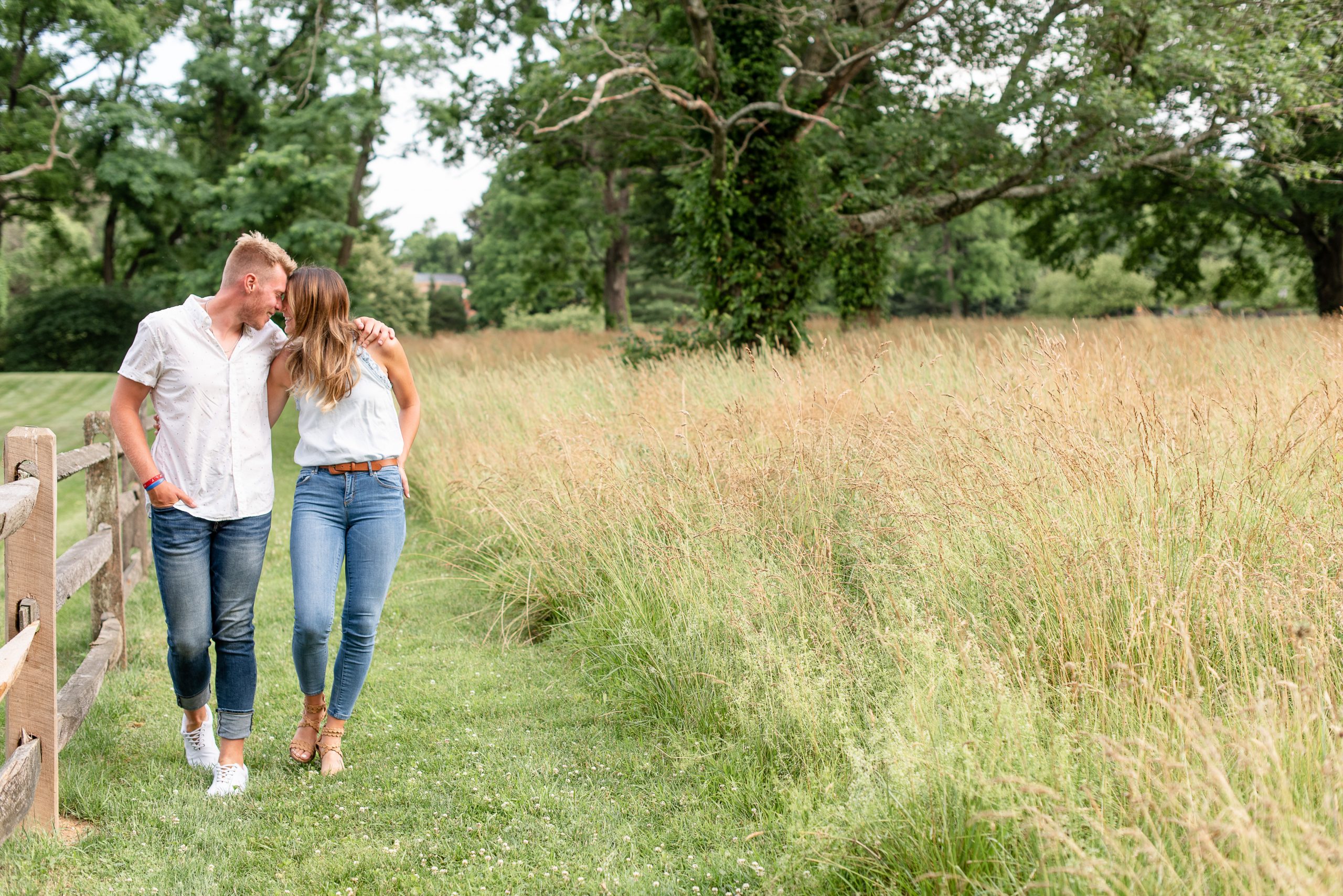 summer engagement session at a field of wild grasses