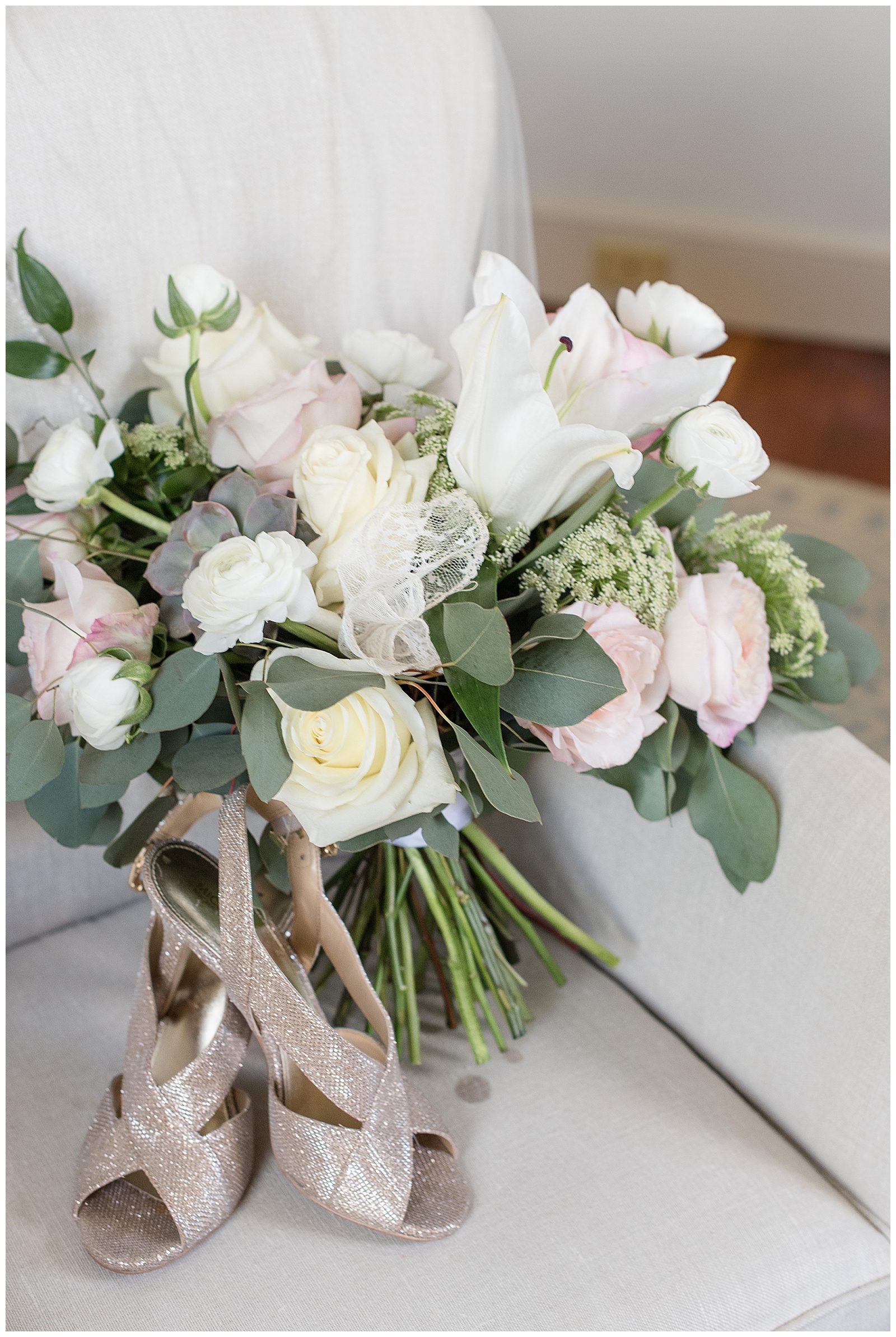 gorgeous bridal bouquet and gold shoes resting on armchair in bridal suite in lancaster pennsylvania
