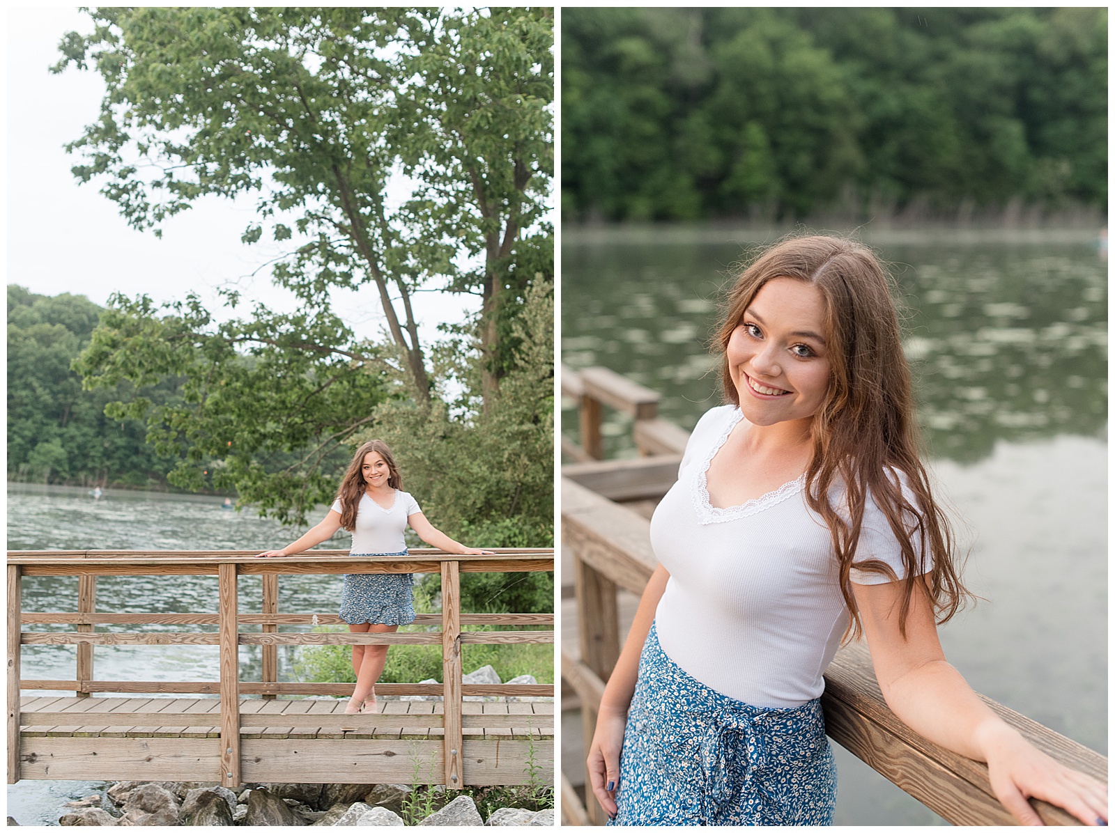 senior girl leaning against rustic wooden fence on dock of lake smiling with large trees behind her