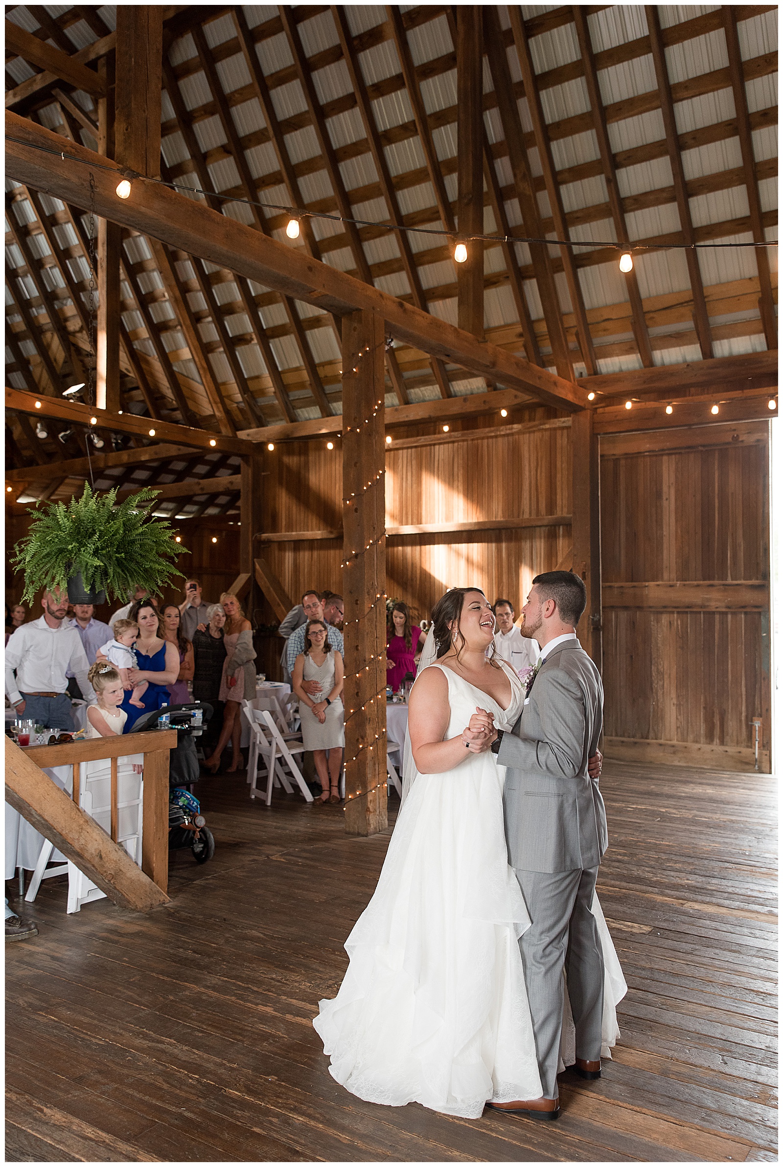 bride and groom in beautiful barn wedding reception doing their first dance at lakefield weddings