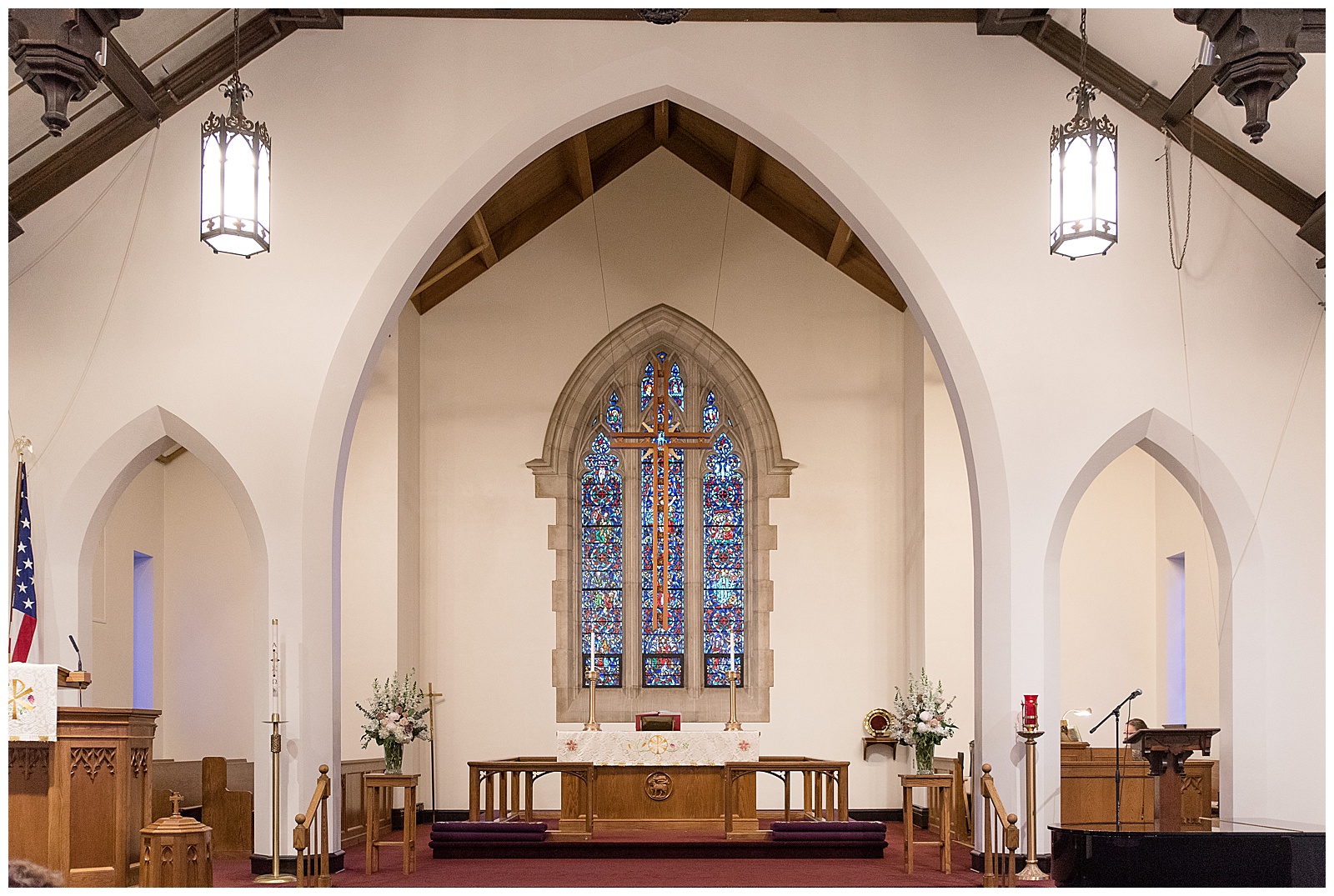 inside redeemer lutheran church sanctuary in lancaster pennsylvania with stained glass window and beautiful archways