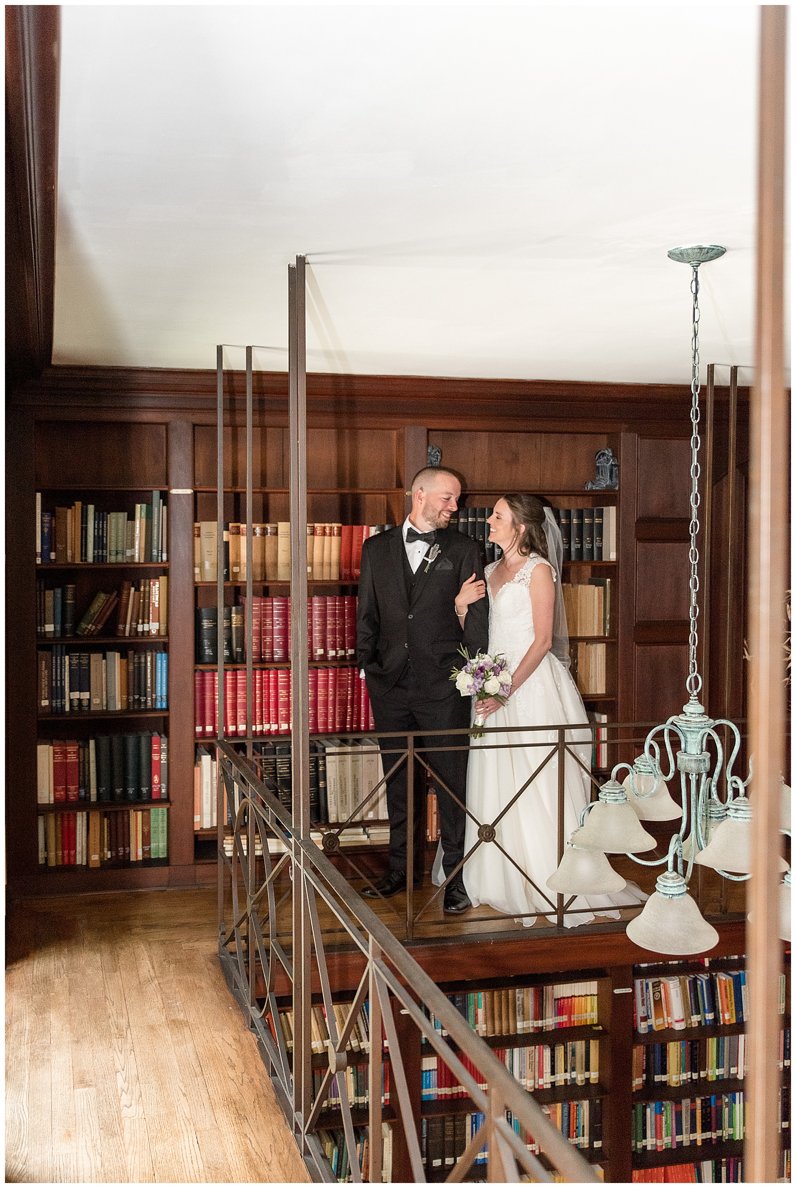 bride and groom portraits in the library at the Shrine of Saint Anthony