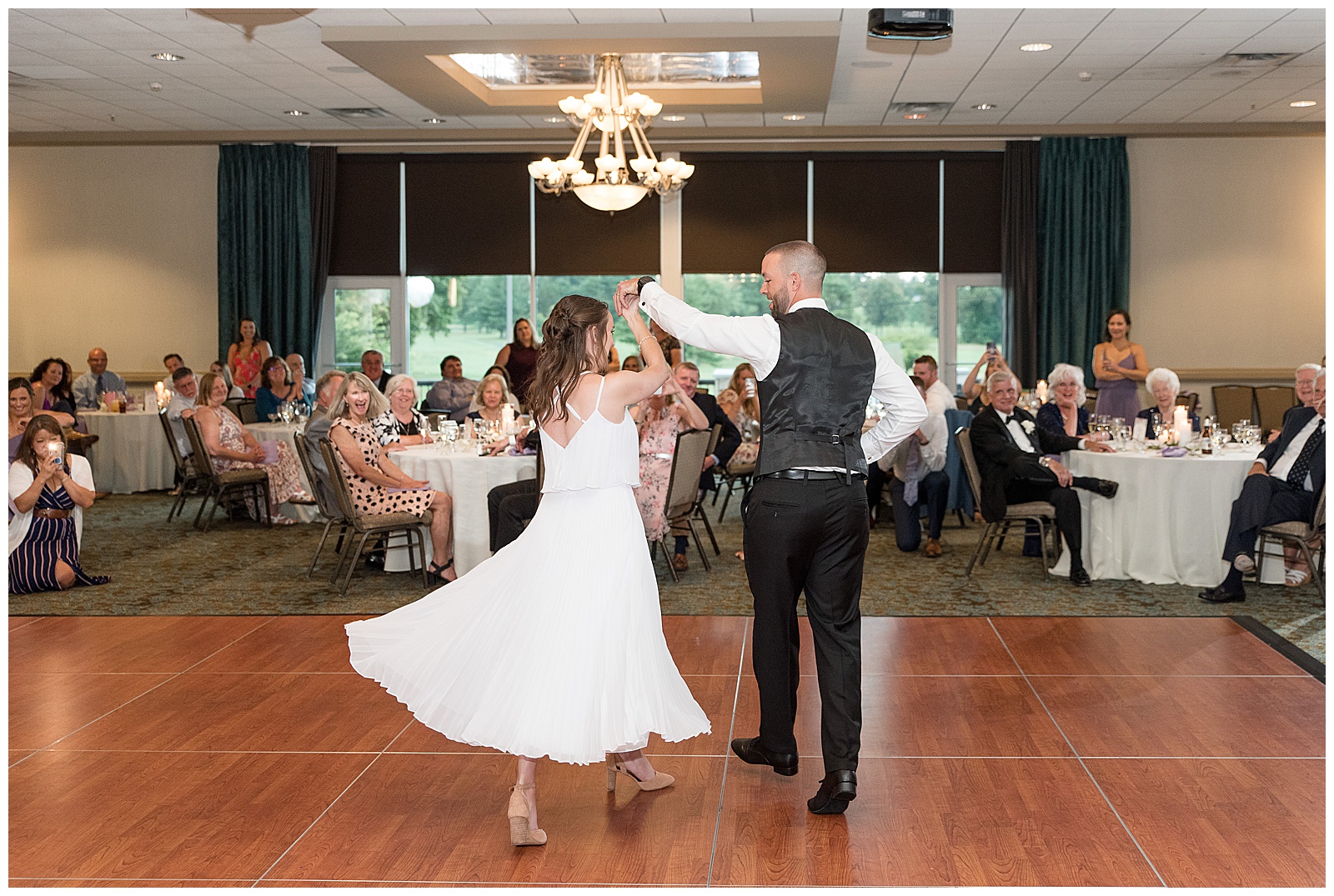 husband and wife share first dance at Turf Valley Resort