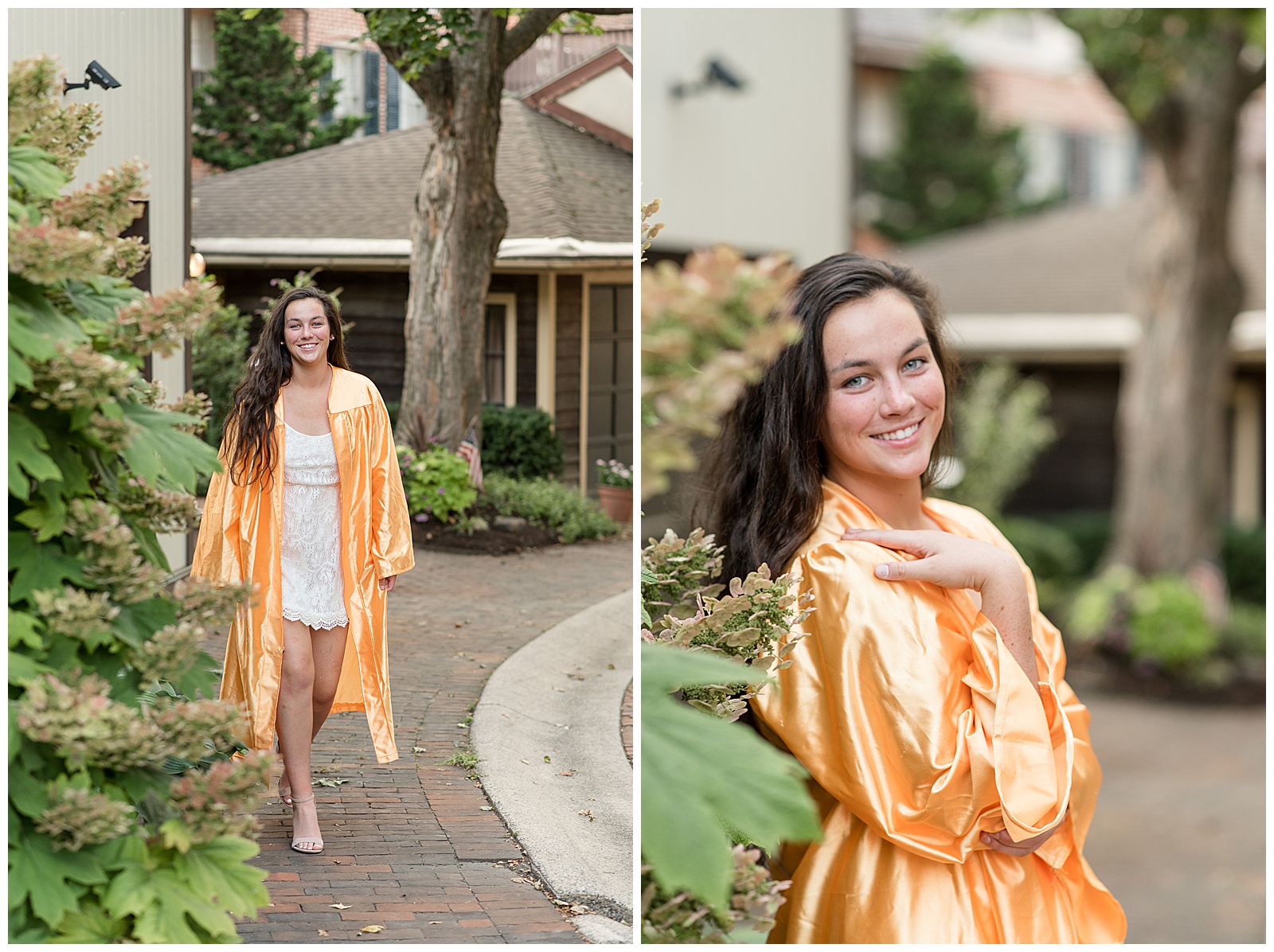 senior girl in yellow graduation gown walking towards camera along brick sidewalk smiling next to green bush