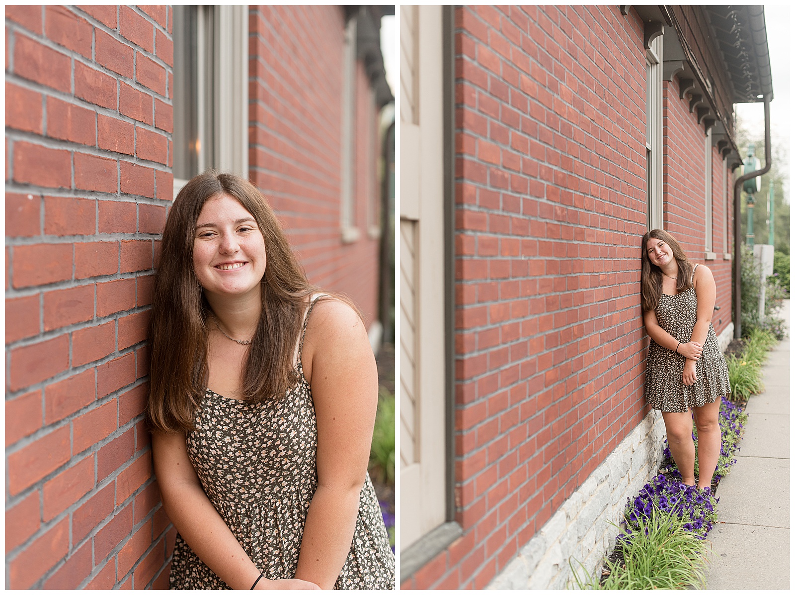 senior girl leaning right shoulder against brick building and holding her hands together as she smiles