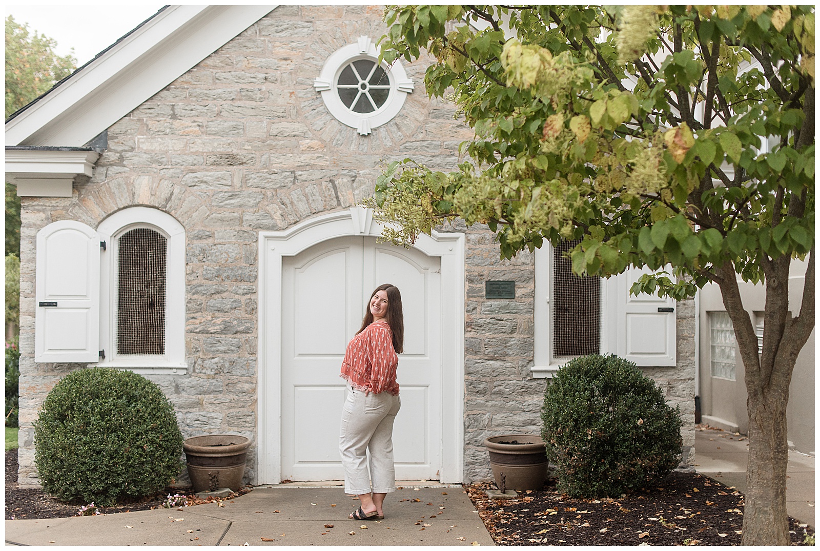 senior girl posing with her left side and shoulder angled towards camera with left hand on hip in lititz pennsylvania