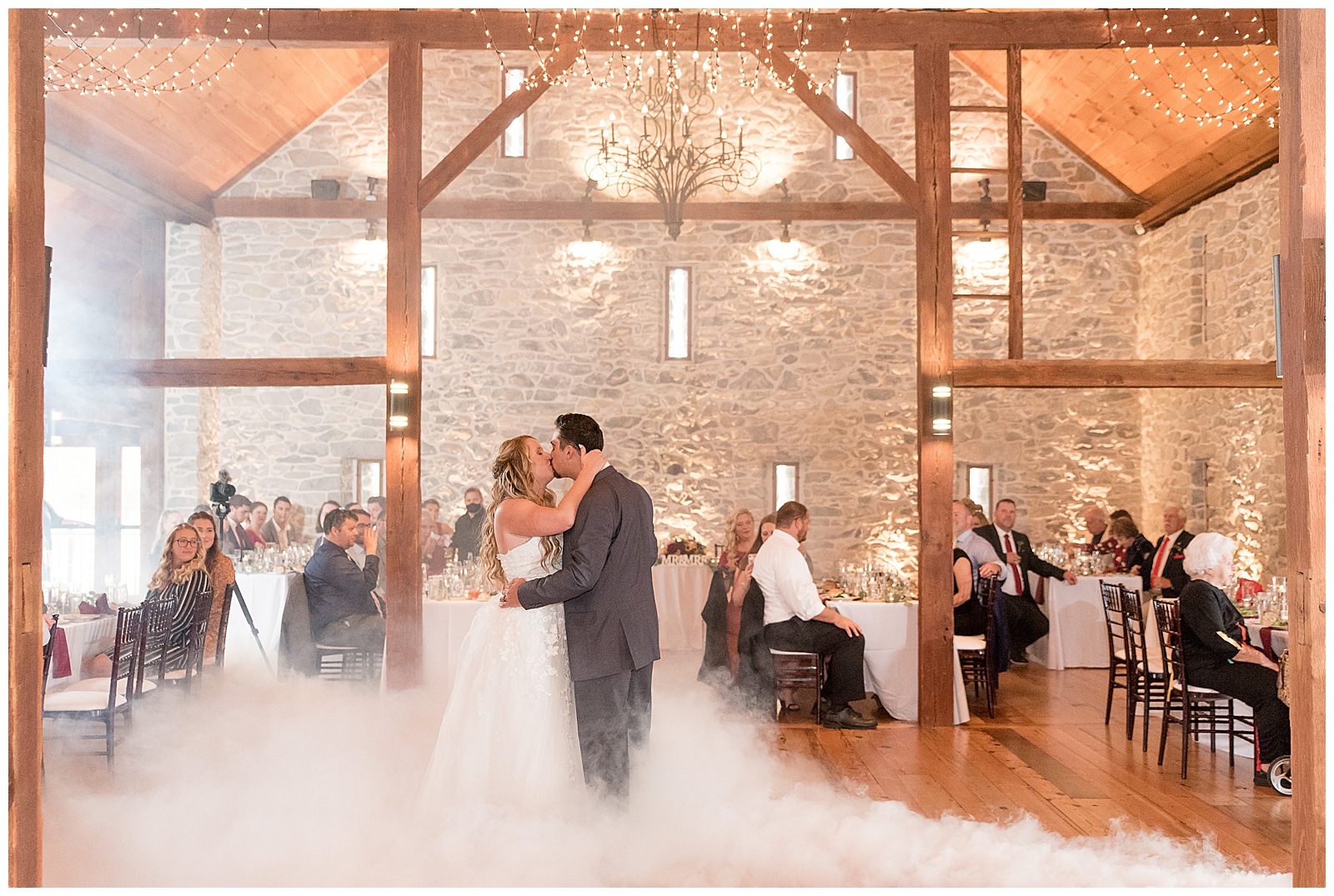couple sharing a kiss as they dance during wedding reception at the barn at silverstone in lancaster pennsylvania