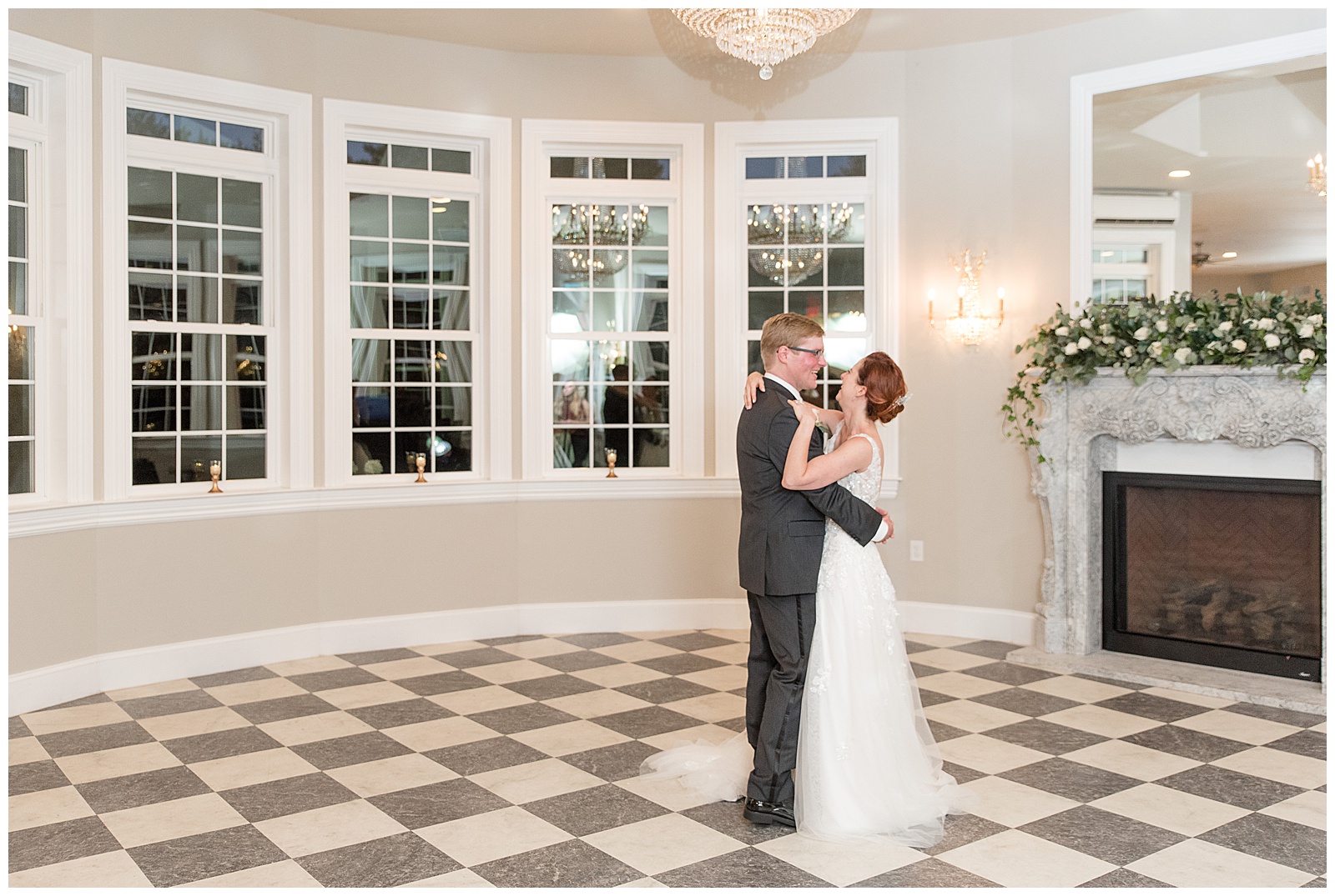 bride and groom sharing their first dance on black and white checkered dance floor at cameron estate inn in mount joy pennsylvania
