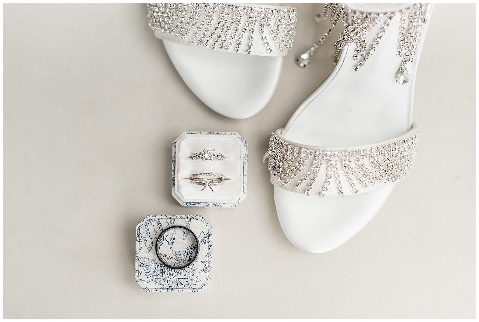 white strappy beaded sandals with wedding rings displayed in boxes at walnut grove farms