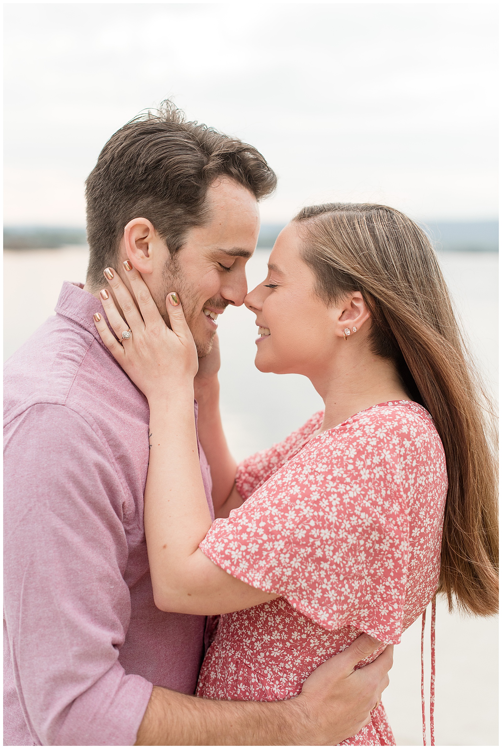 close up photo of engagement couple almost kissing with their eyes closed as she gently holds his neck and their noses touch