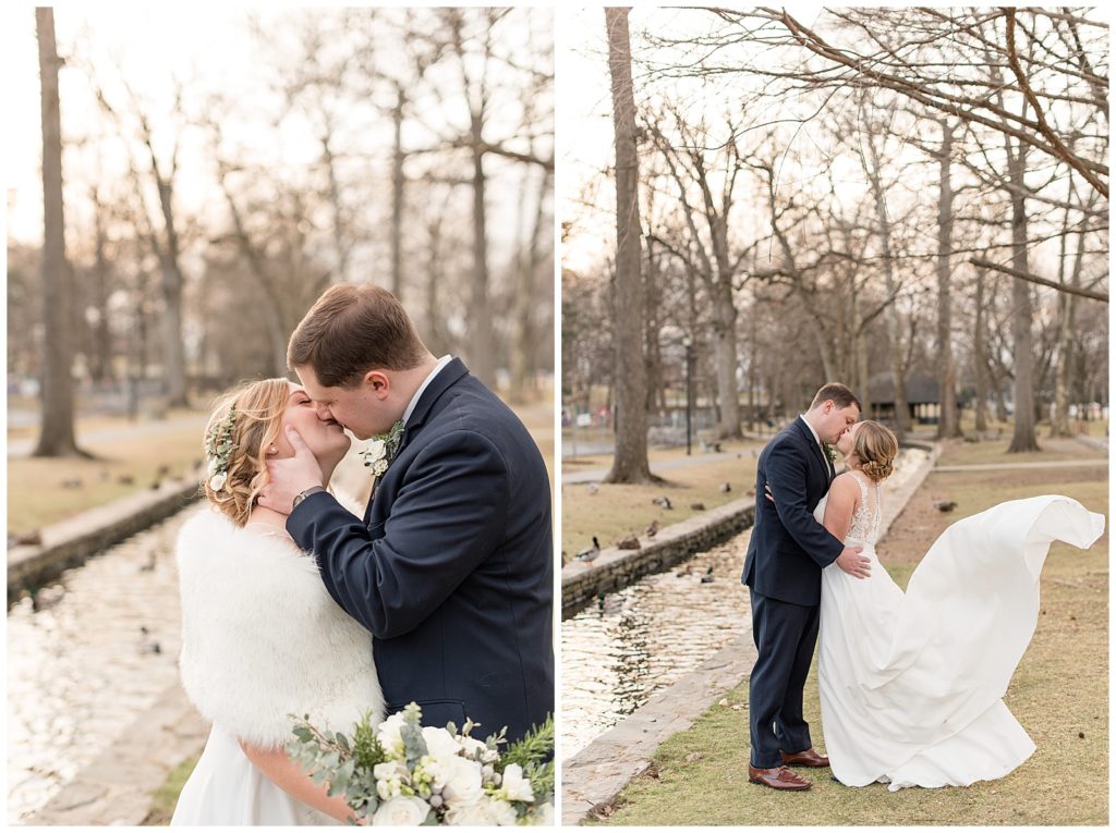 bride and groom standing along fence kissing on beautiful winter day