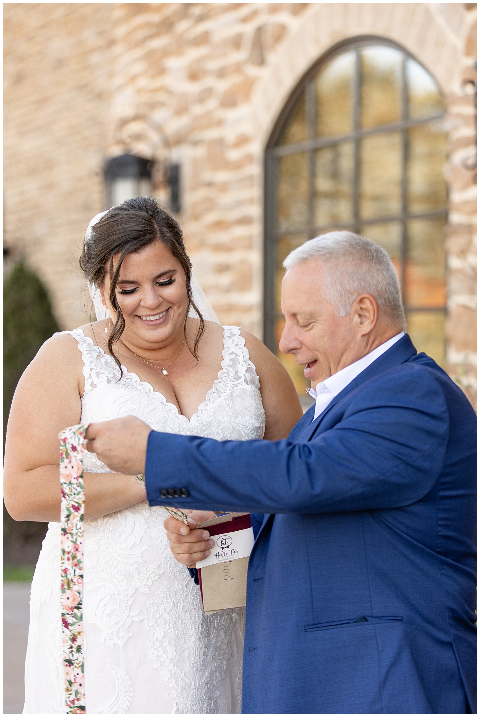 bride sharing a special moment with her father as they both smile outside at folino estate