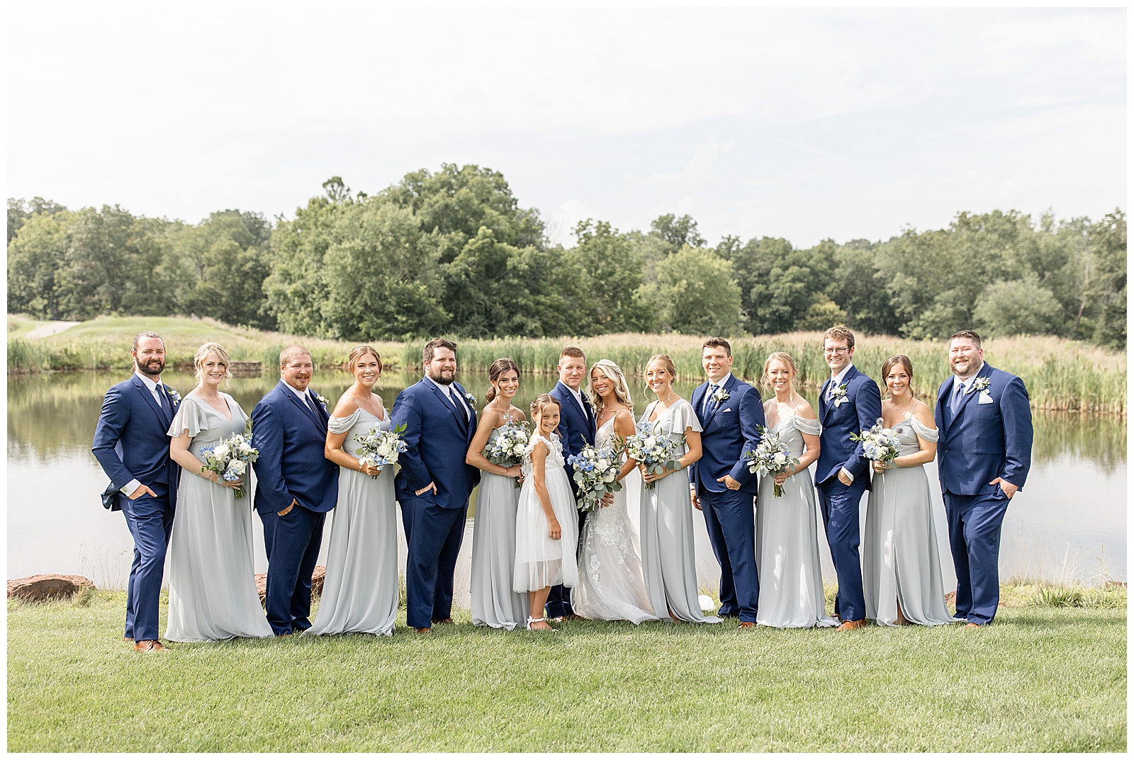 couple surrounded by their bridal party on sunny summer day at the links at gettysburg