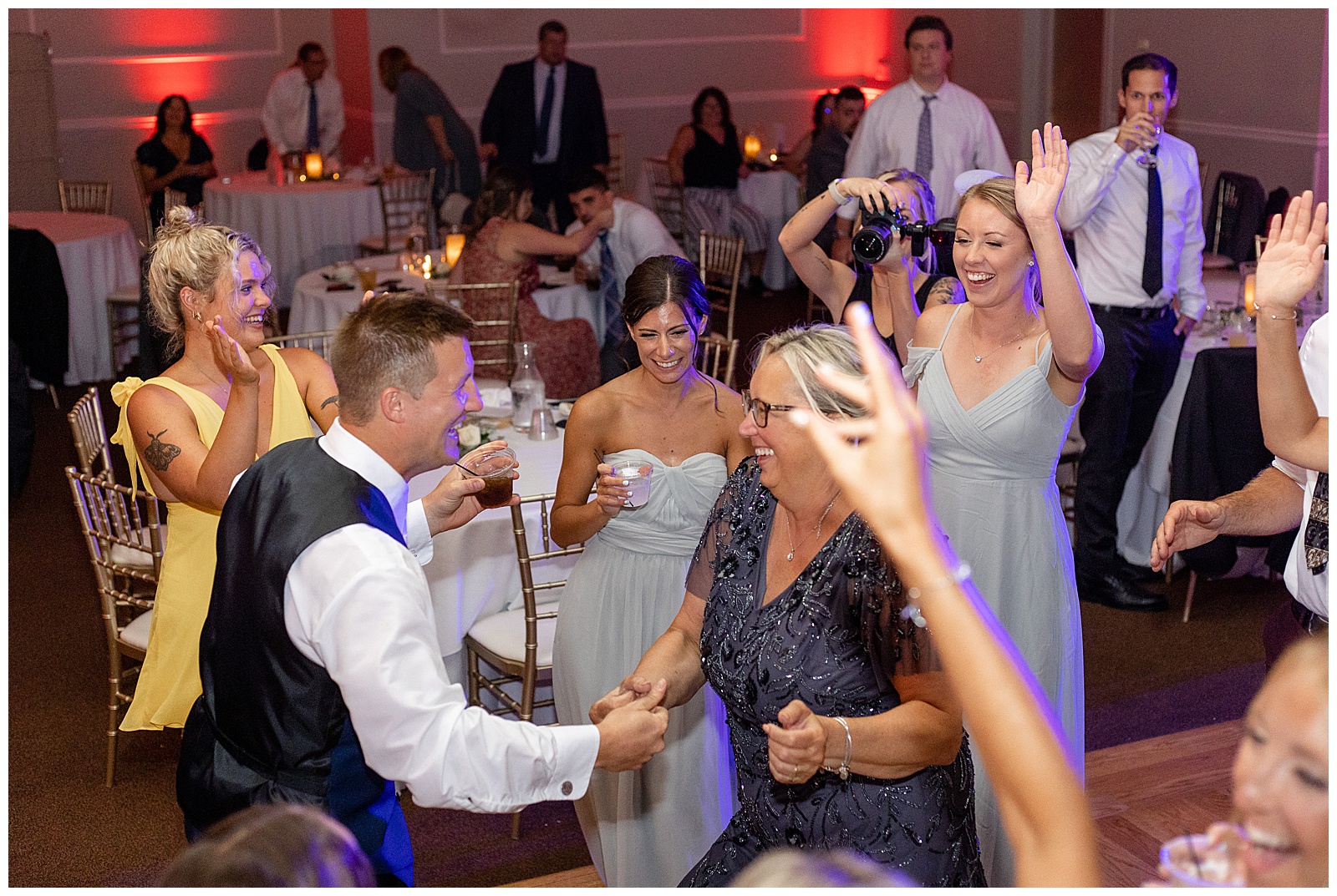 groom dancing with guests during their reception at the links at gettysburg in central pennsylvania