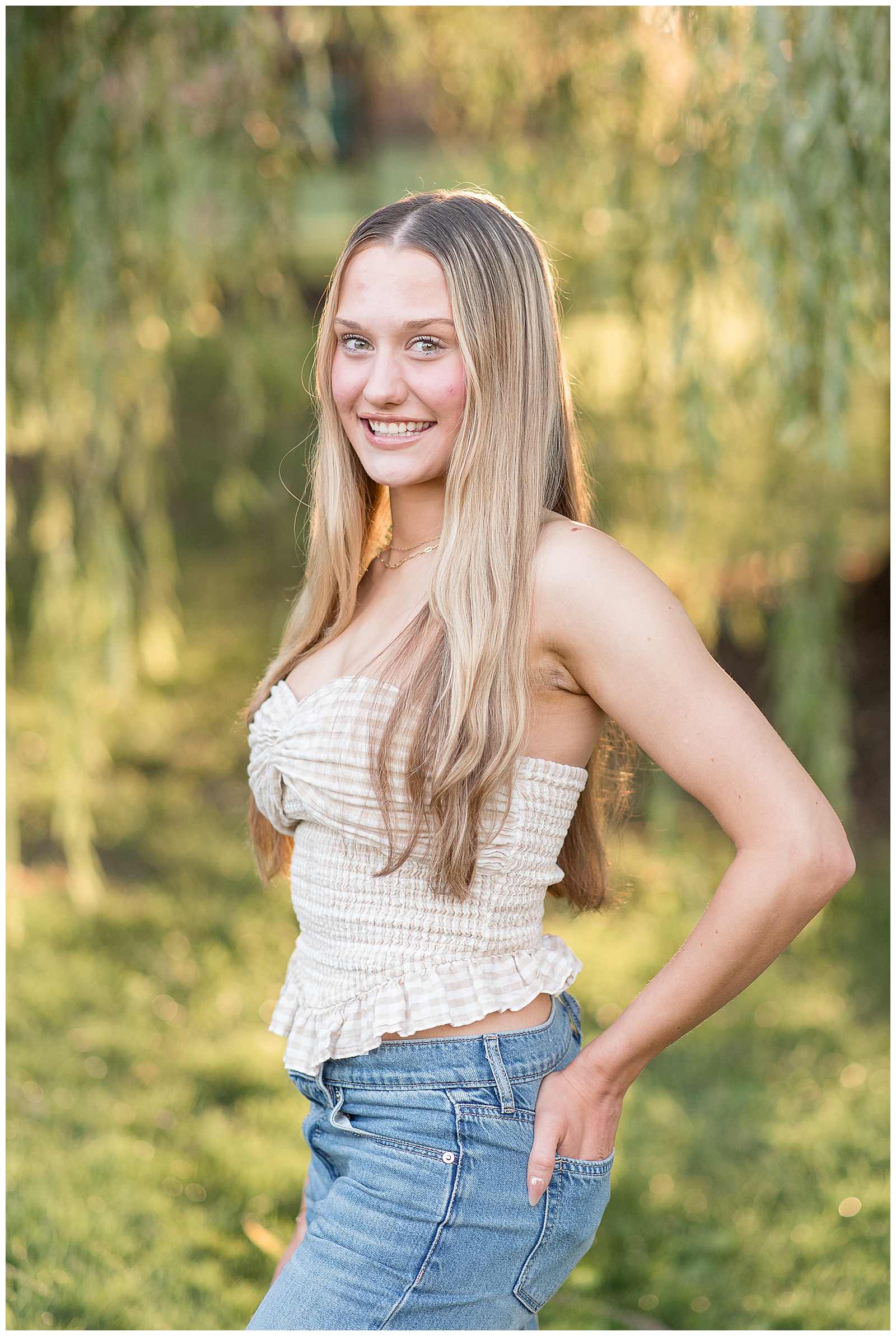 senior girl in white tube top with hands in back jean pockets for this Lancaster Senior Spokesmodel Mini Sessions in Greenfield Park