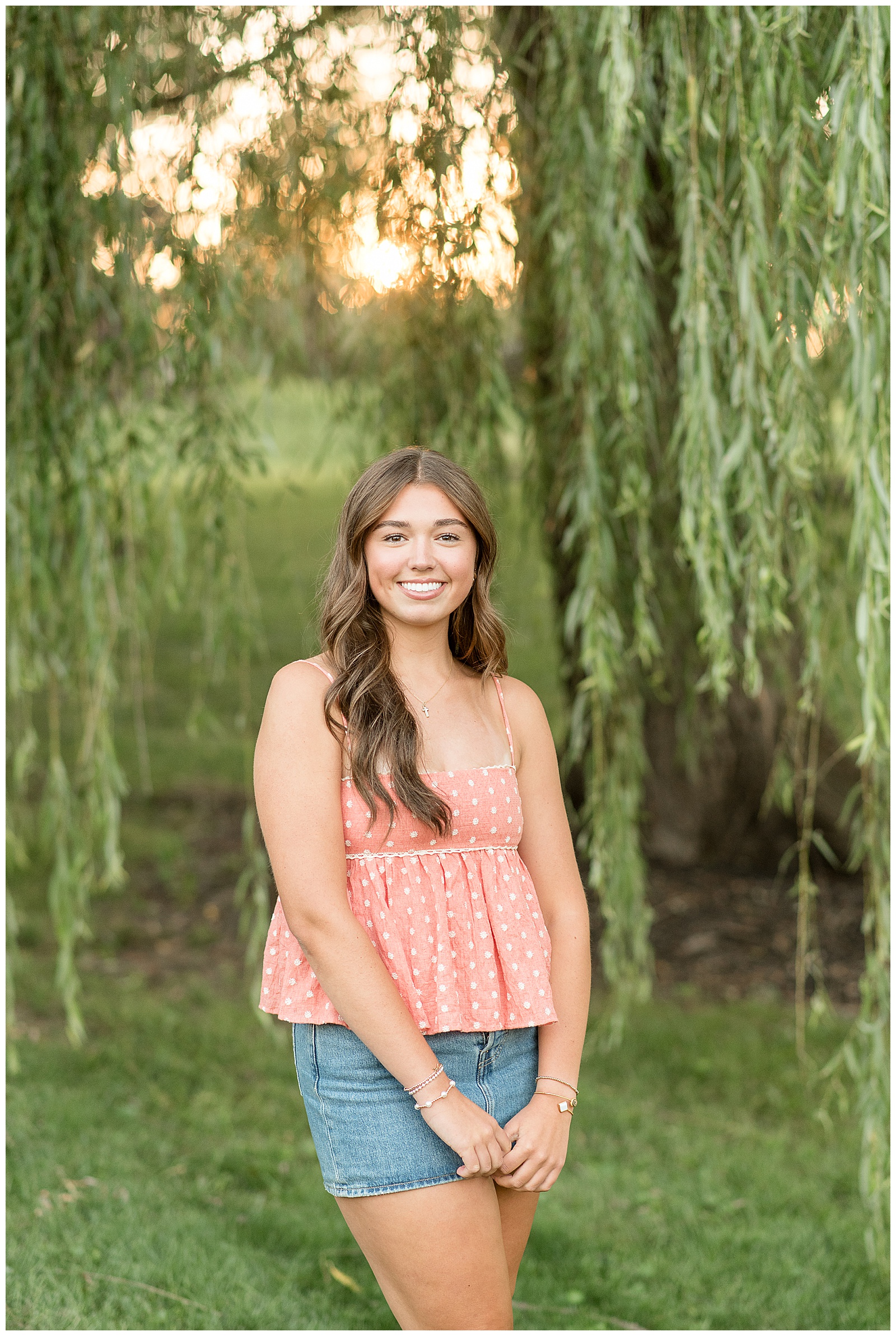senior girl in peach spaghetti strap shirt with jean shorts by willow tree for this Lancaster Senior Spokesmodel Mini Sessions in Greenfield Park