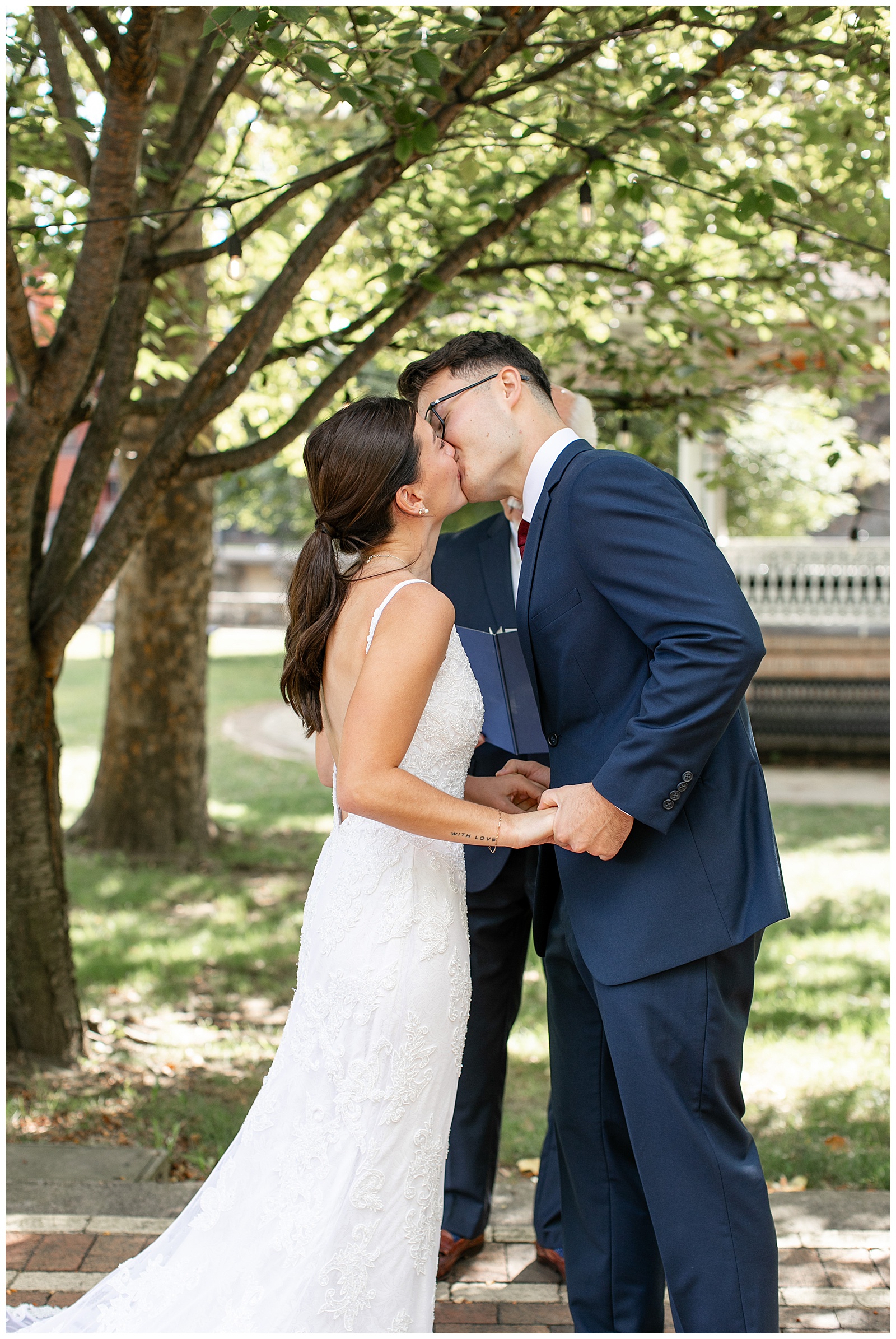 couple holding hands and kissing for this Intimate Central PA Elopement in Centre County