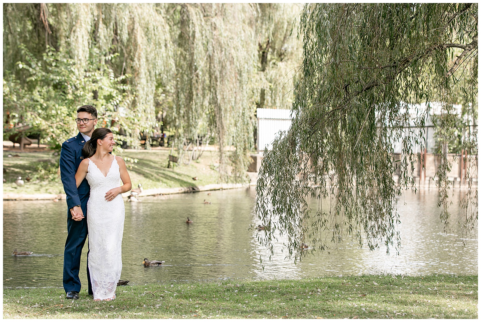 groom hugging his bride from behind by pond for this Intimate Central PA Elopement