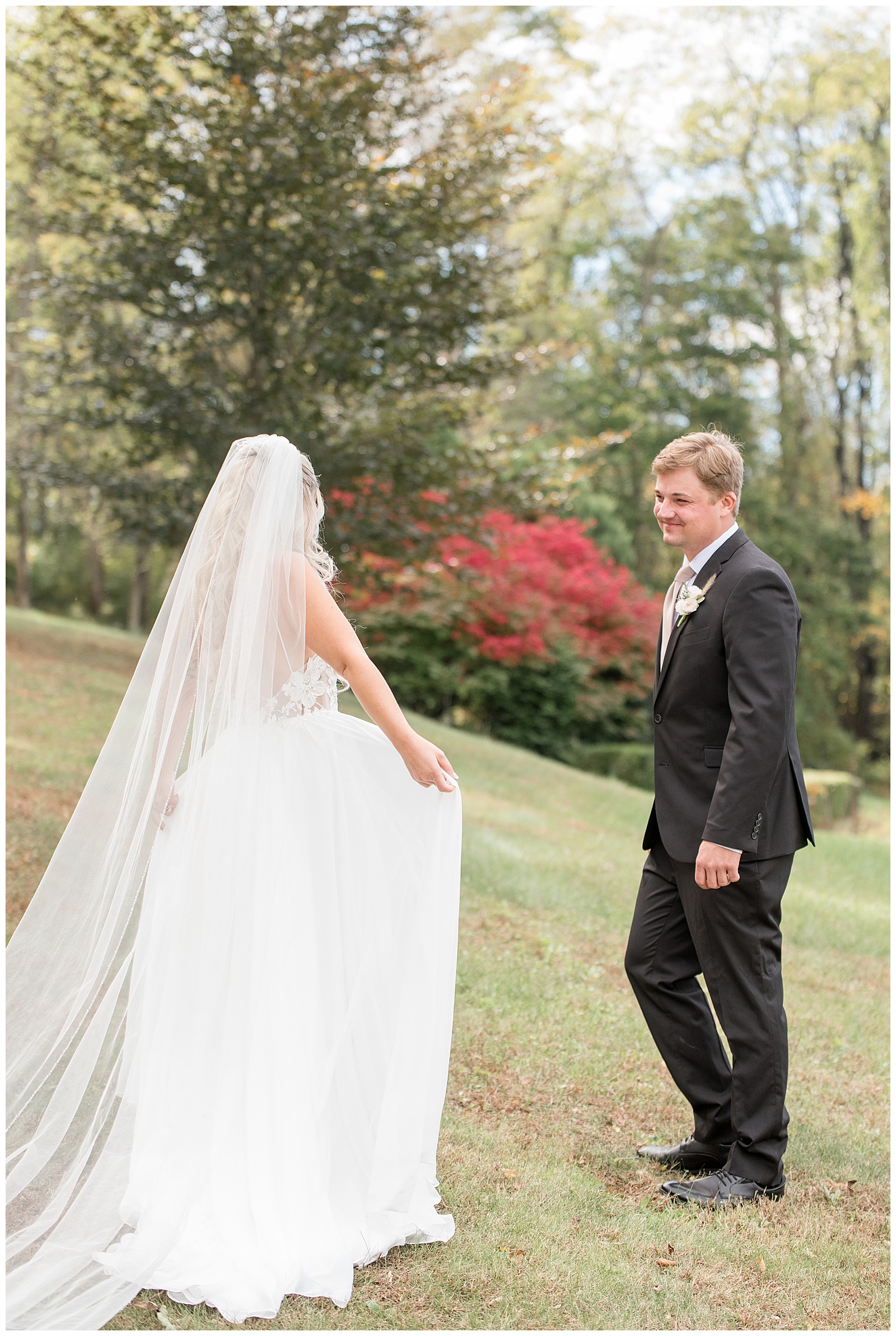 couple sharing their first look moment as groom smiles big for this Central PA Farm Wedding