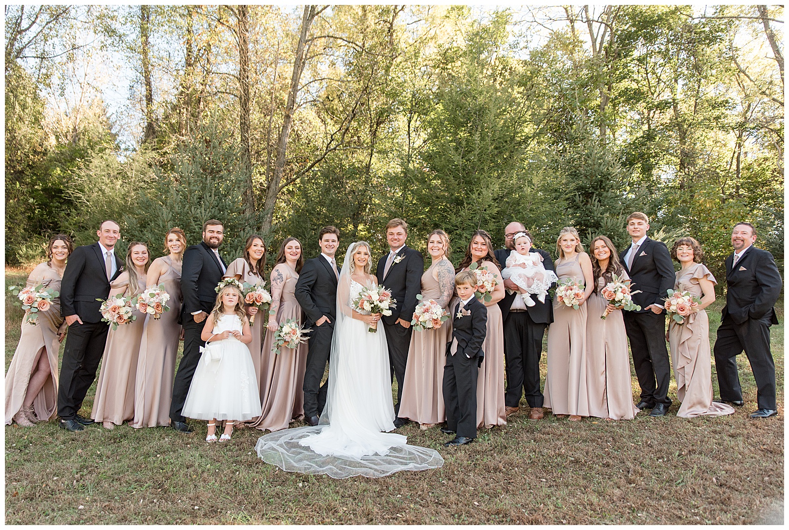 couple with their bridal party on sunny fall day for this Central PA Farm Wedding