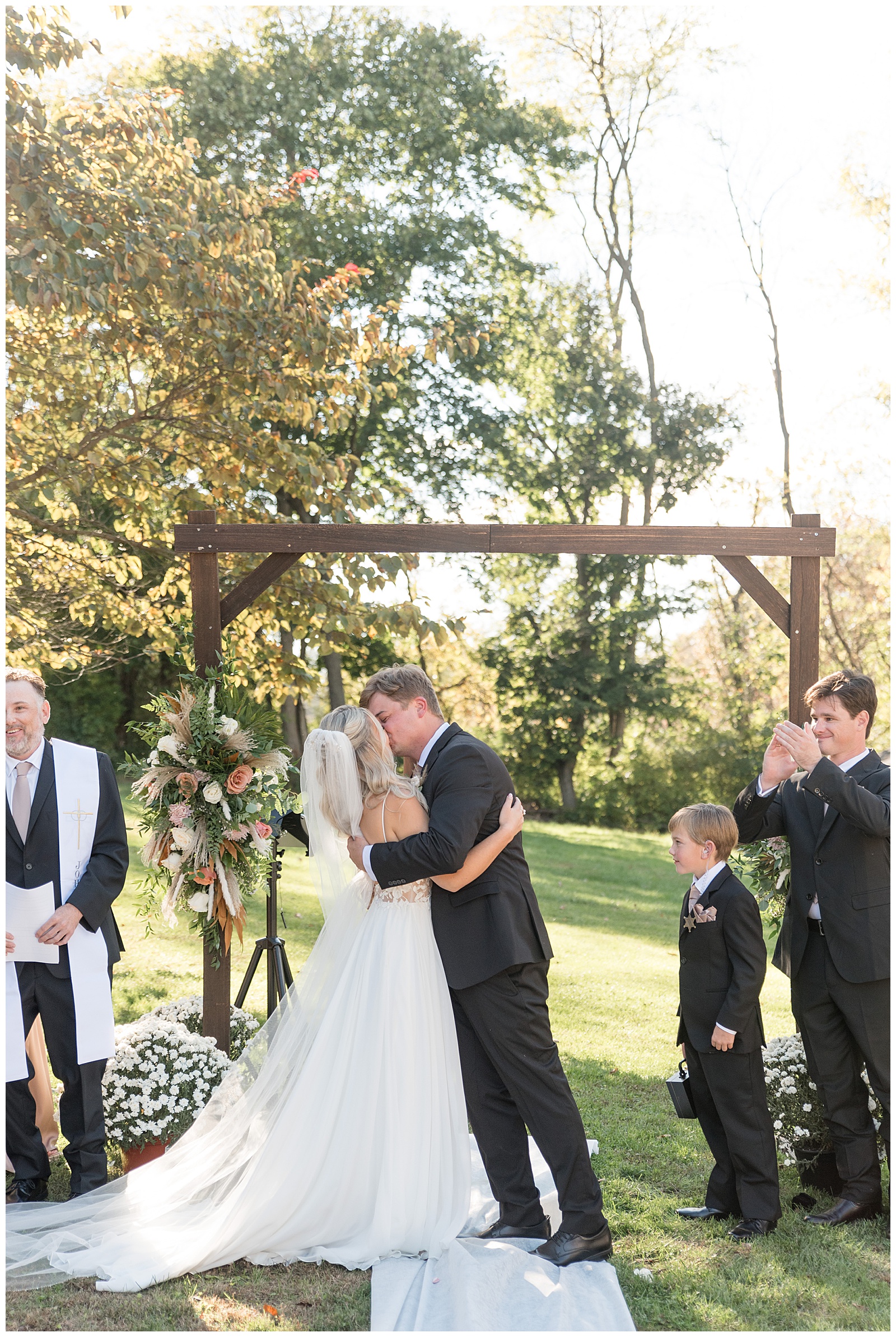 couple kissing during outdoor wedding ceremony for this Central PA Farm Wedding