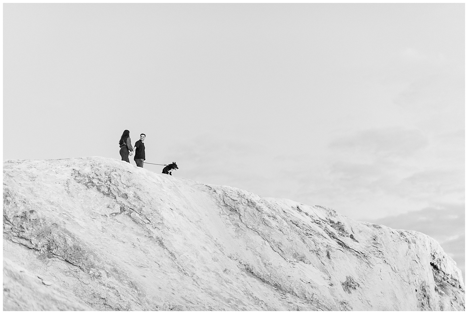 couple and their pup atop white mountain for this White Cliffs of Conoy Fall Couples Session