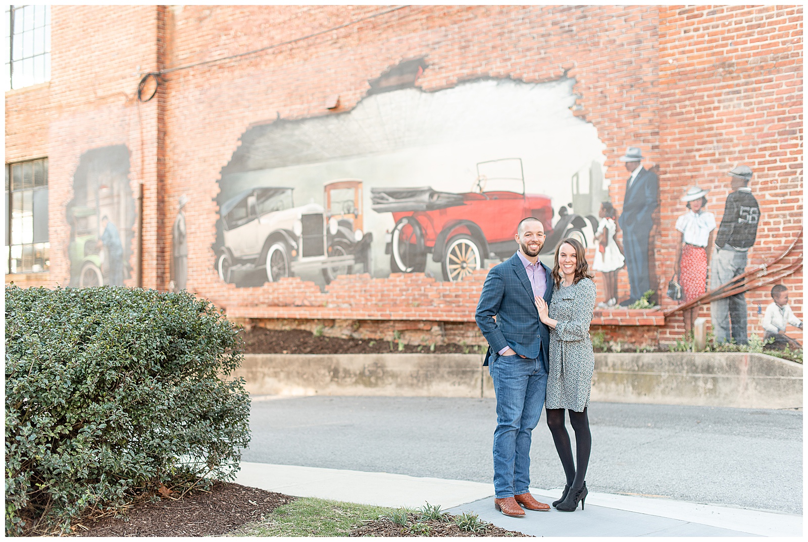 engagement session photos in fron of car mural in Ellicott City, Maryland