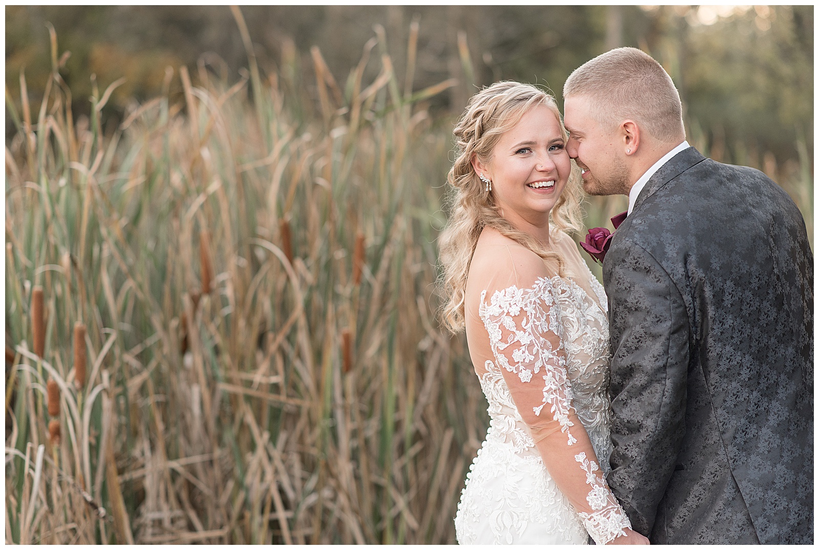 bride looking at camera smiling as groom smiles resting his forehead against her near cornfield in dover pennsylvania