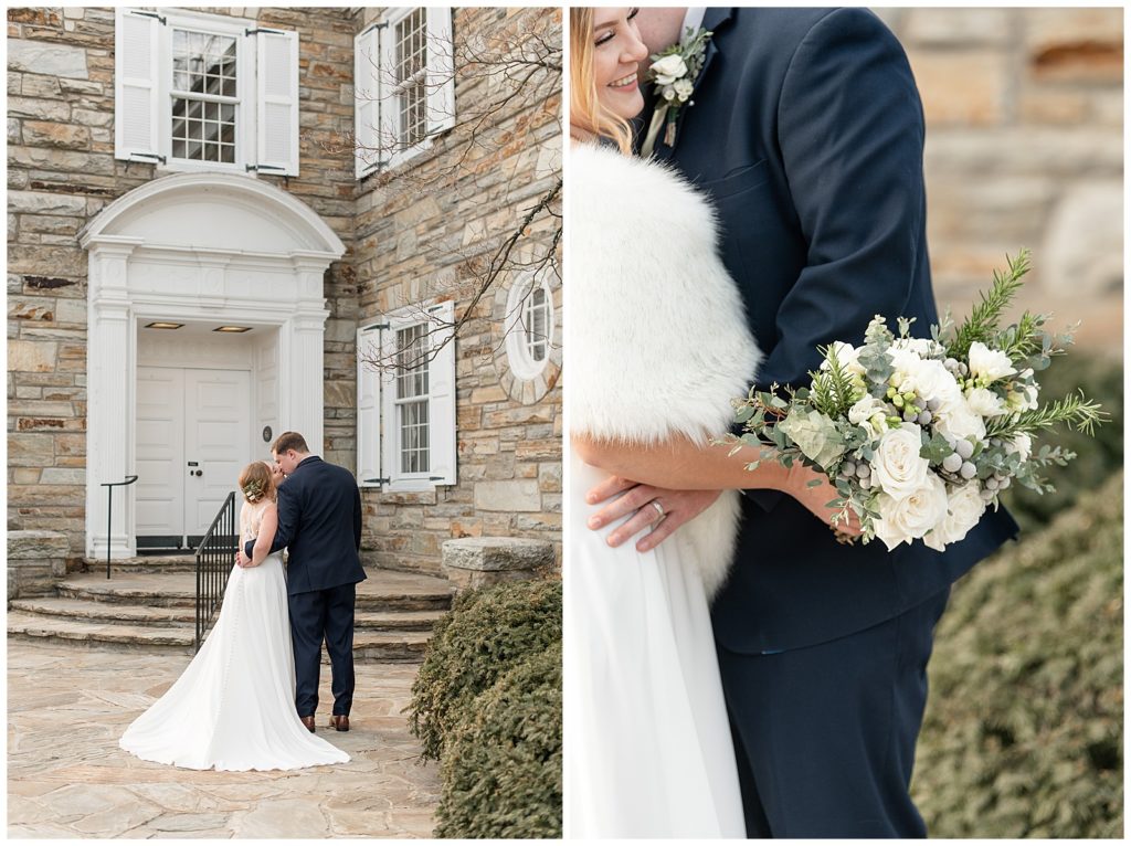 bride and groom kissing with their backs toward the camera by old stone building on winter day